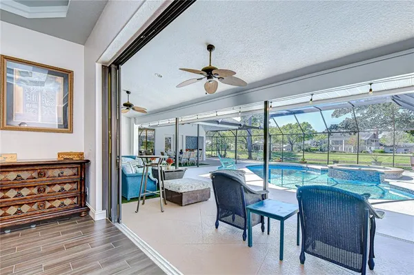 a bathroom with a tub double sink window and mirror