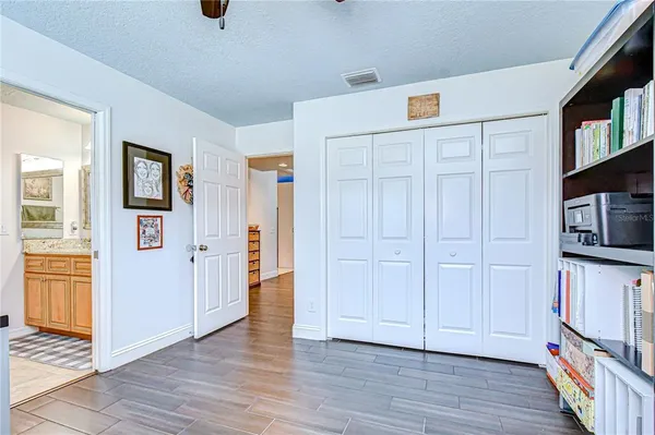 a bedroom with a bed and a cabinets