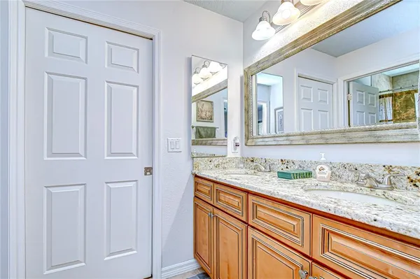 a view of a backyard with swimming pool