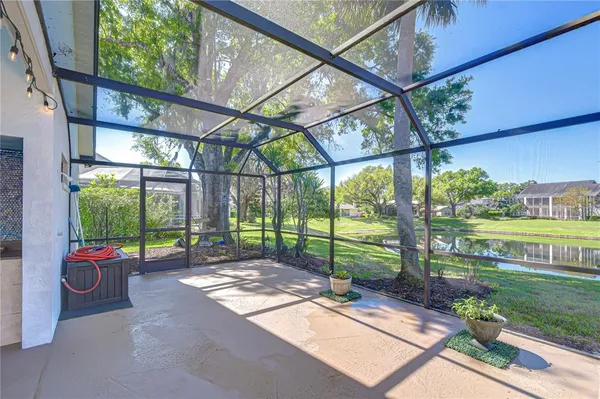 a view of a lake with houses in the back