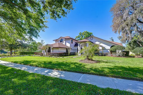 a view of a house with a big yard