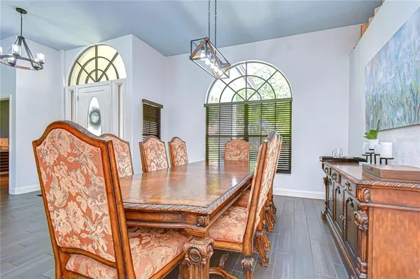 a living room with furniture a rug and a window