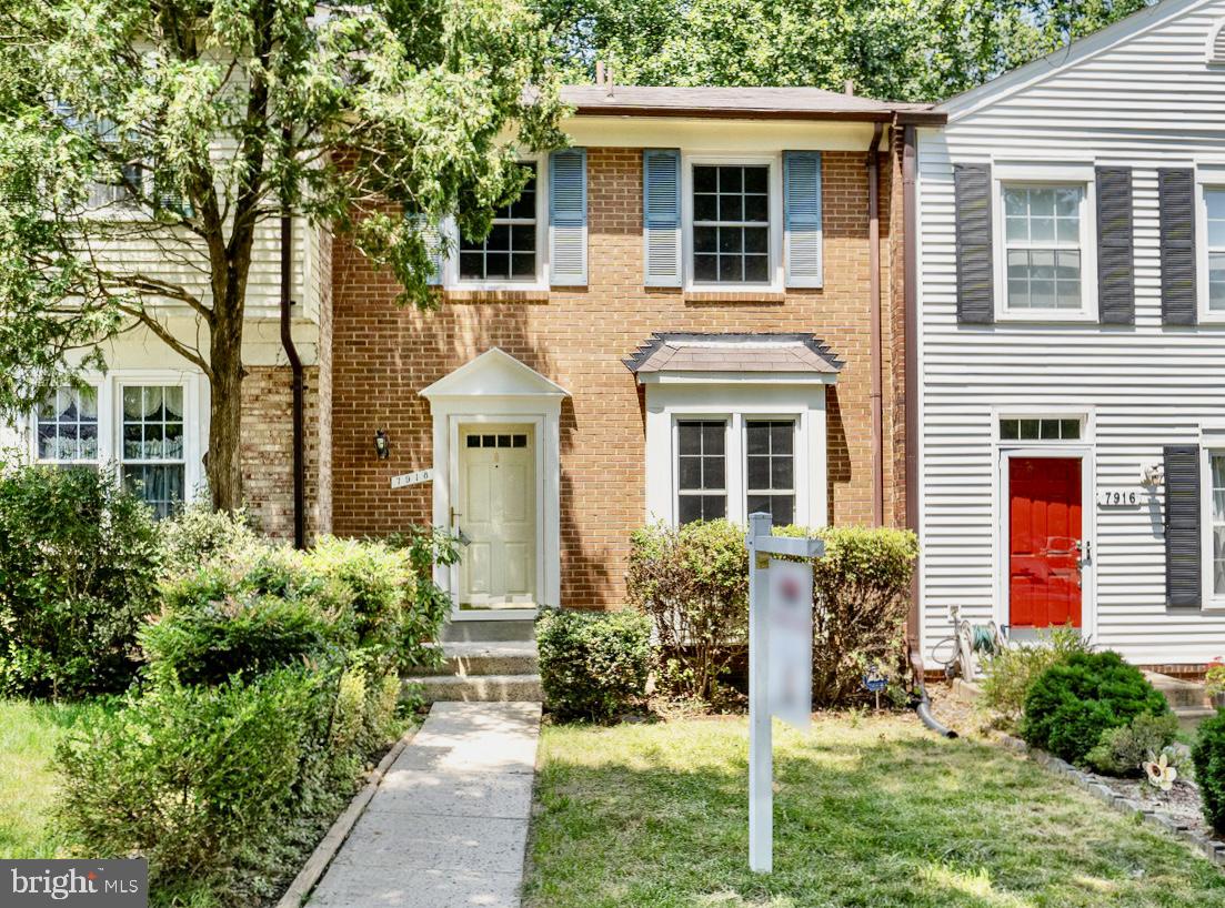 7918 Pebble Brook Court Springfield, VA 22153 - Photo 1 of 28 a front view of a house with a yard