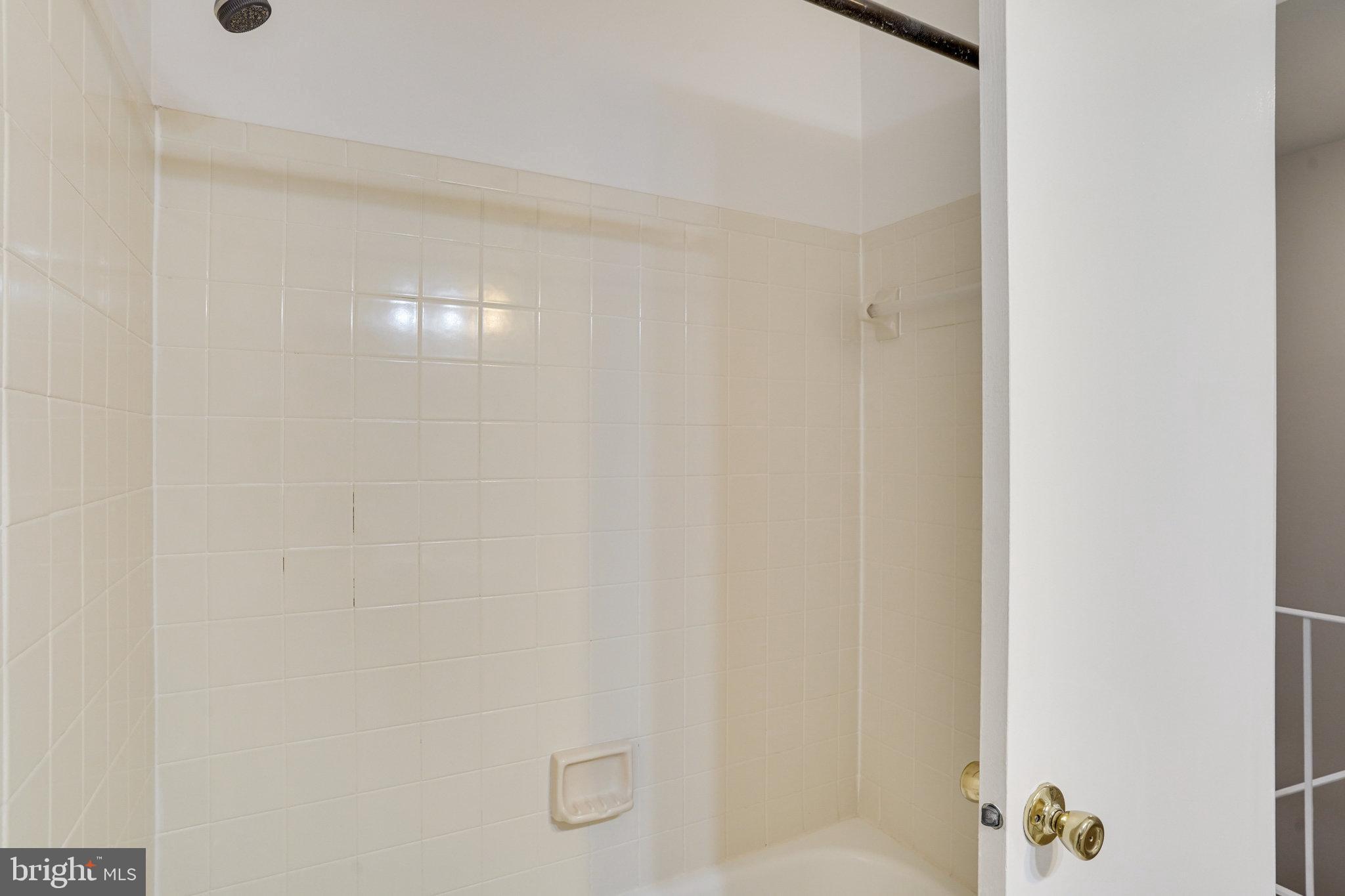 7918 Pebble Brook Court Springfield, VA 22153 - Photo 16 of 28 a bathroom with a shower