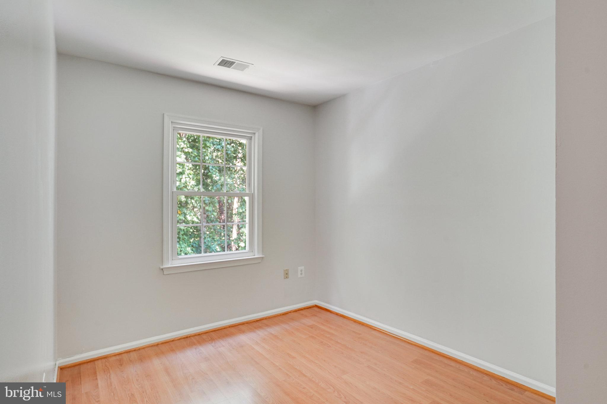 7918 Pebble Brook Court Springfield, VA 22153 - Photo 19 of 28 an empty room with a window