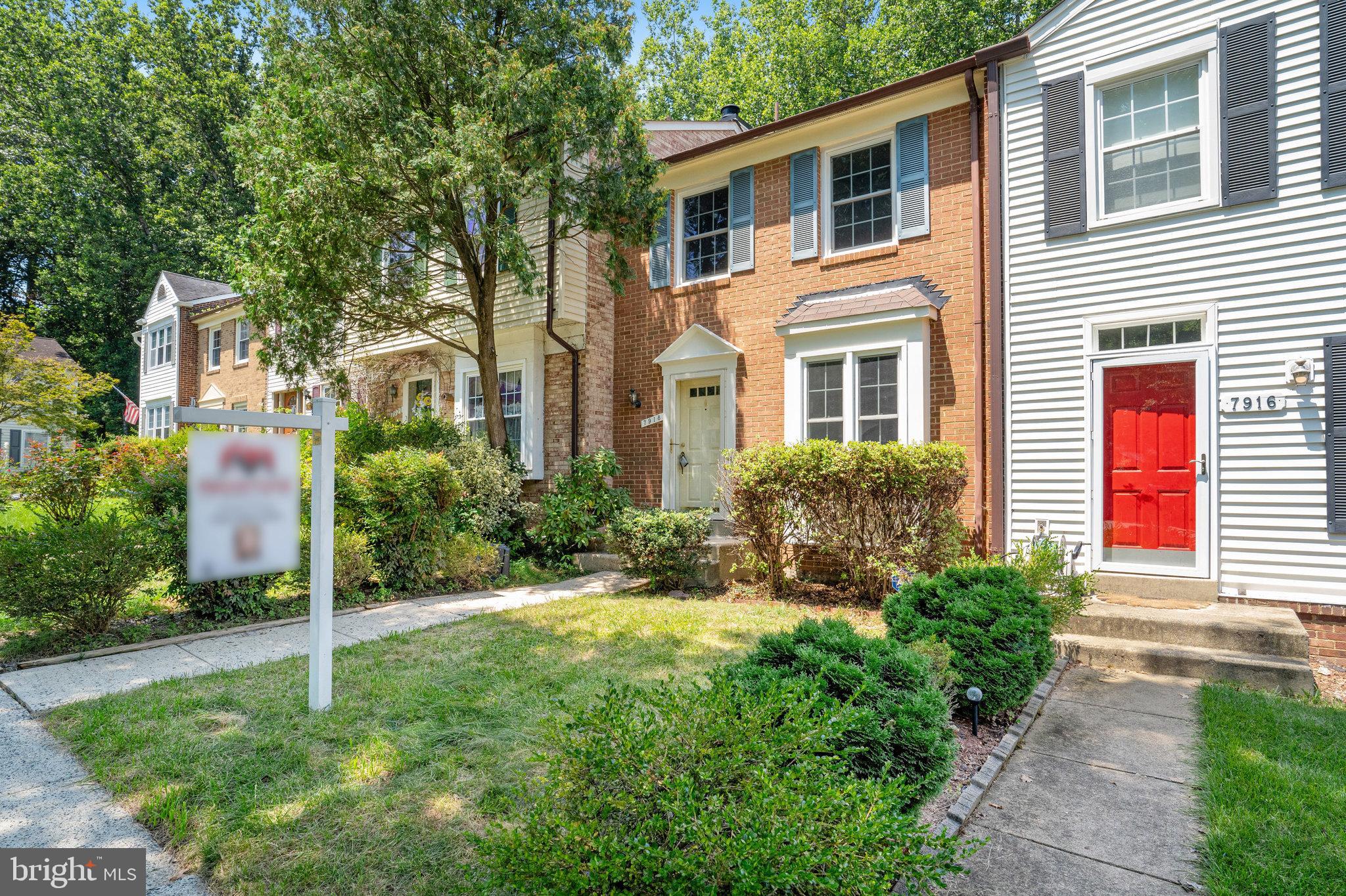 7918 Pebble Brook Court Springfield, VA 22153 - Photo 2 of 28 a house view with a garden space