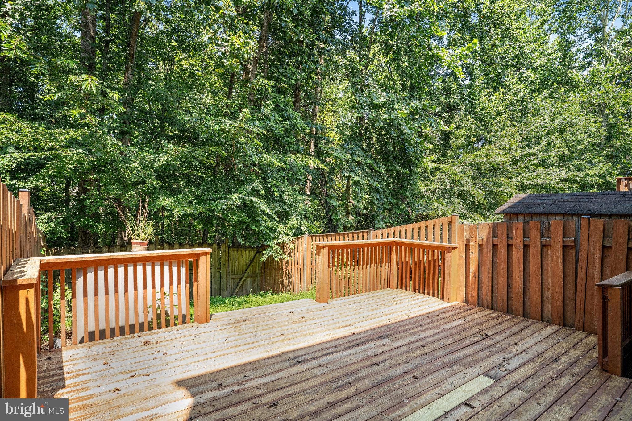 7918 Pebble Brook Court Springfield, VA 22153 - Photo 26 of 28 a deck view with wooden floor and fence