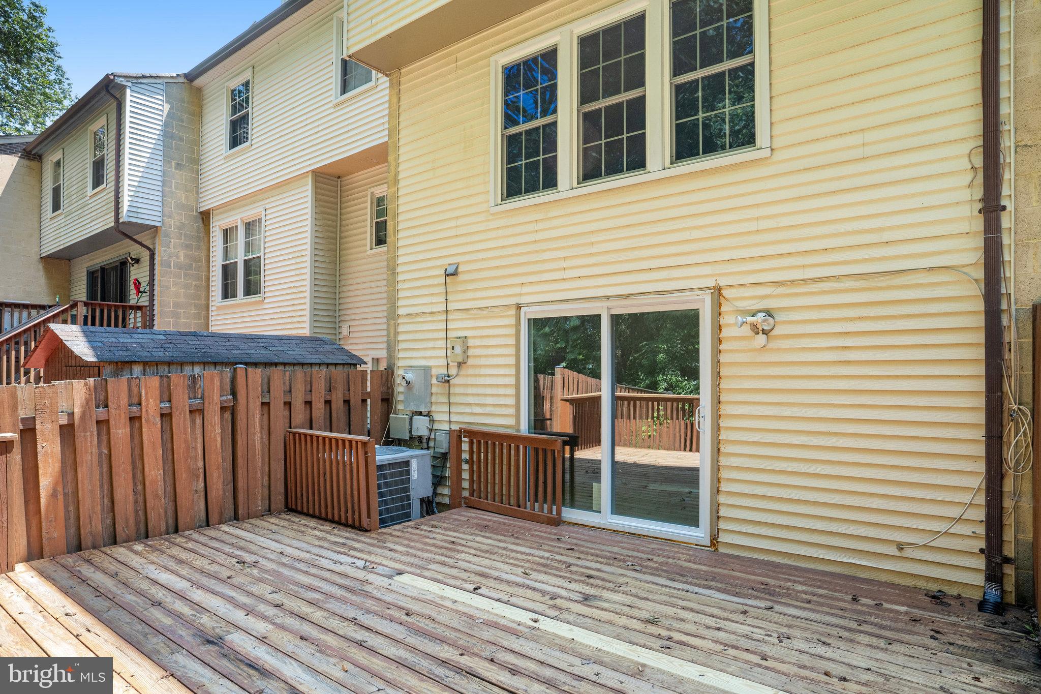 7918 Pebble Brook Court Springfield, VA 22153 - Photo 27 of 28 a view of a house with wooden deck