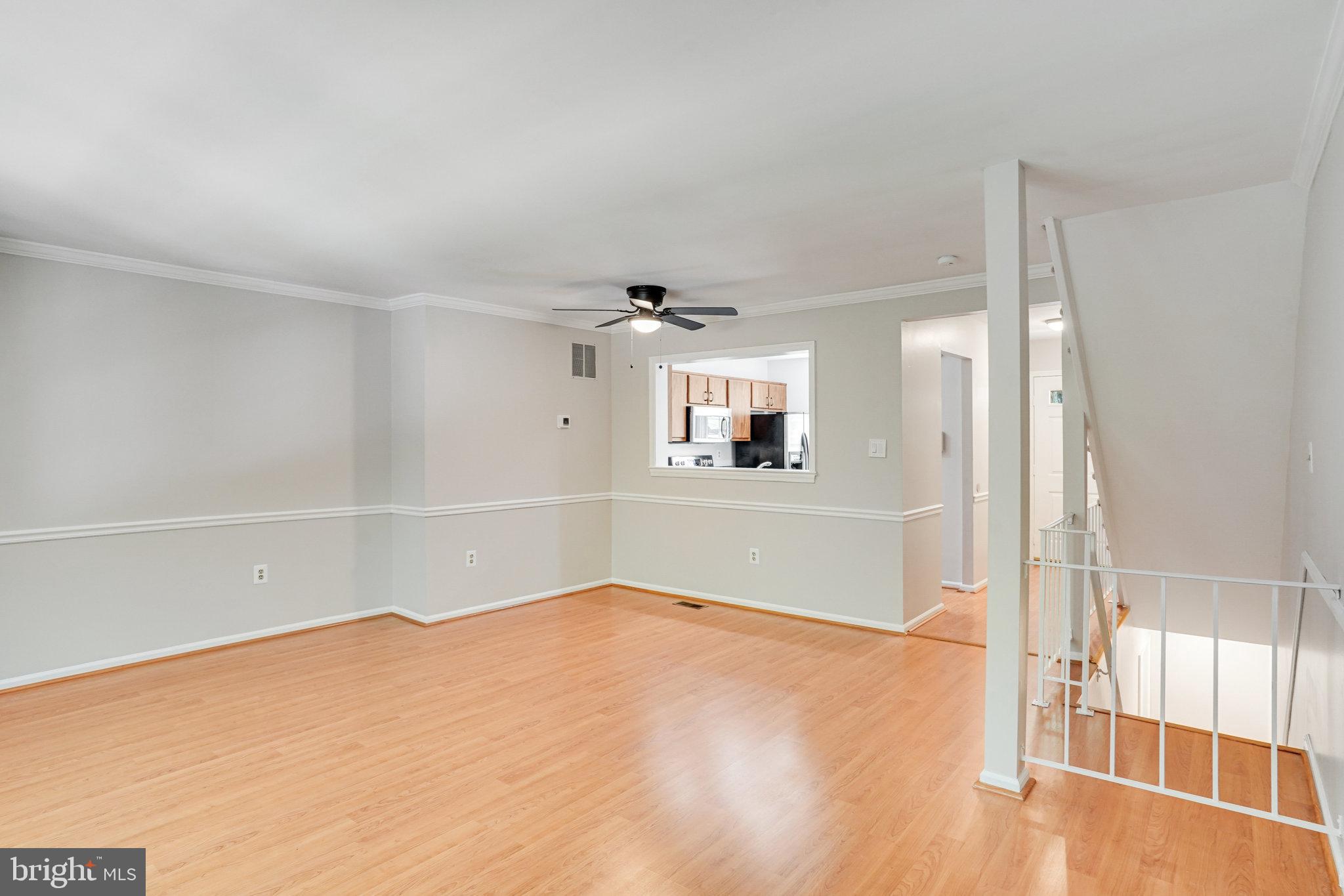 7918 Pebble Brook Court Springfield, VA 22153 - Photo 9 of 28 an empty room with a empty space and windows