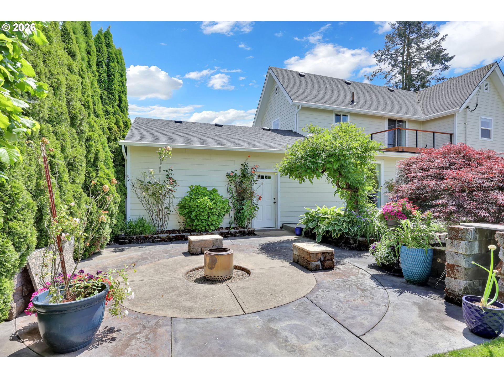 90440 Goodman Road Junction City, OR 97448 - Photo 34 of 48 a view of a backyard with potted plants