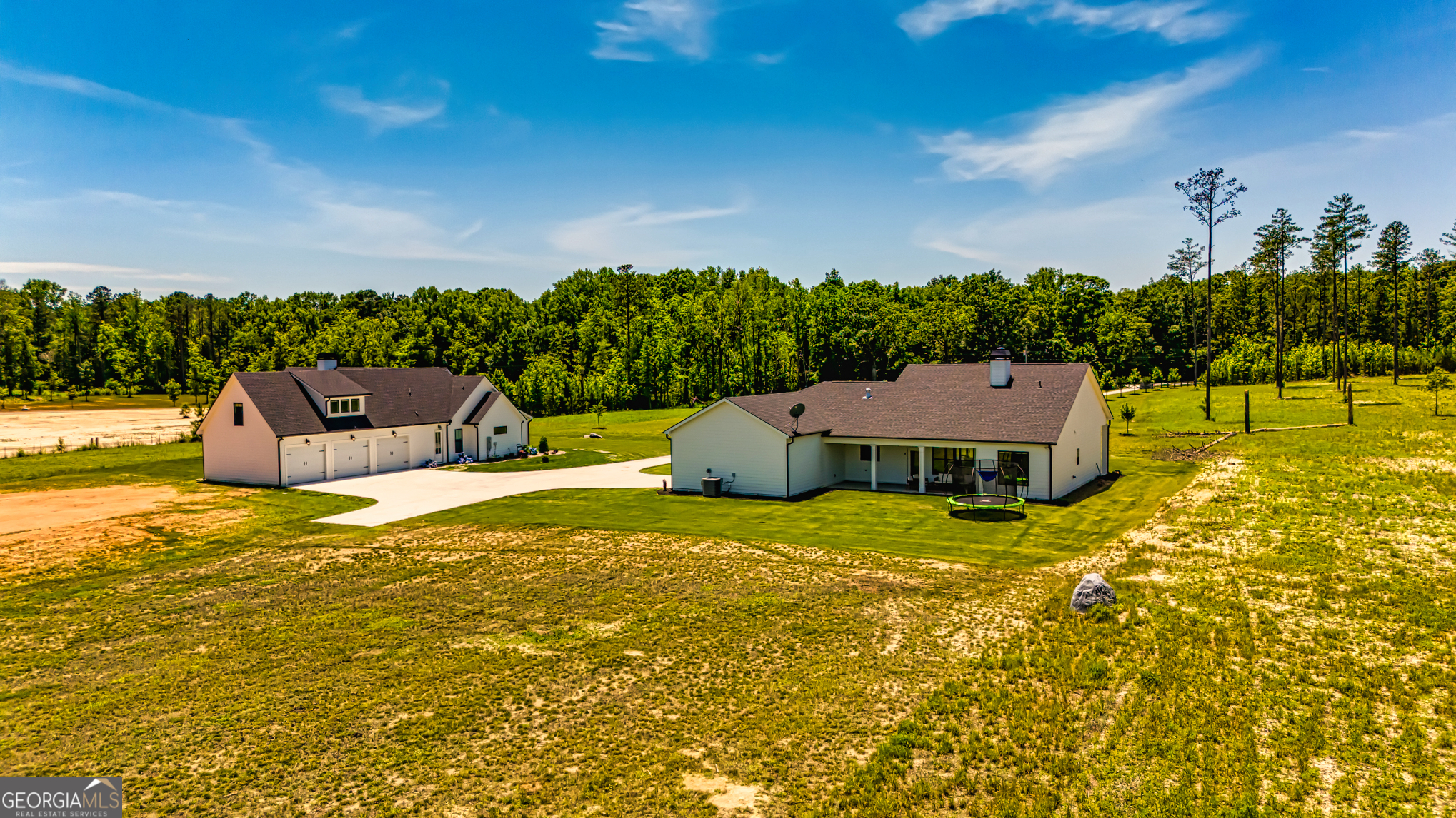 11084 Mt Carmel Road Senoia, GA 30276 - Photo 113 of 136 an aerial view of a house with a yard basket ball court and outdoor seating