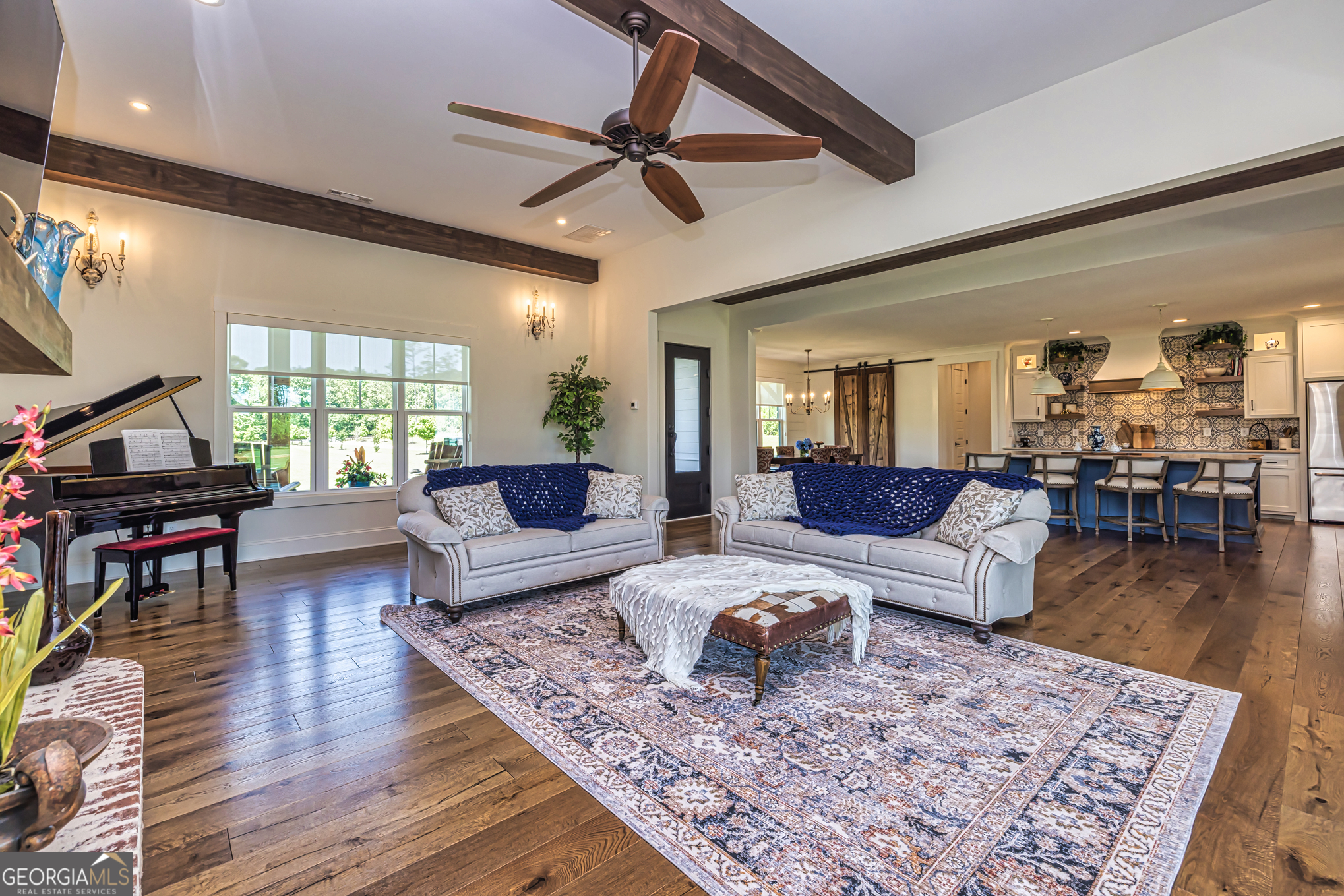 11084 Mt Carmel Road Senoia, GA 30276 - Photo 12 of 136 a living room with furniture and a wooden floor