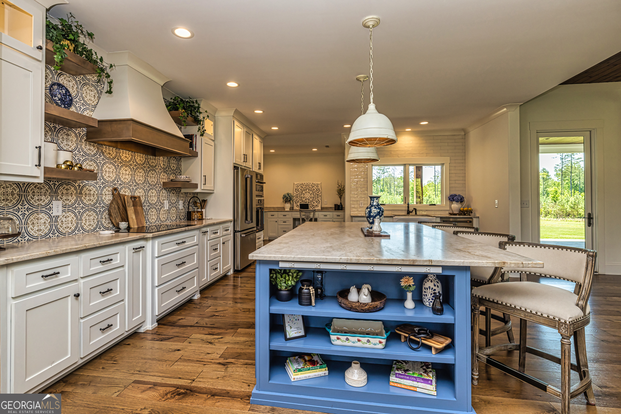 11084 Mt Carmel Road Senoia, GA 30276 - Photo 14 of 136 a kitchen with stainless steel appliances kitchen island granite countertop a stove a sink and a wooden floors