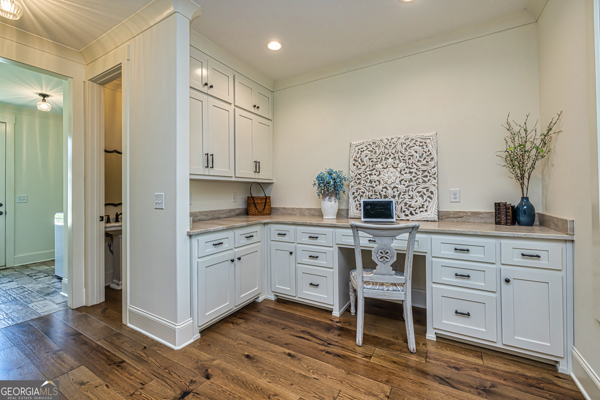 11084 Mt Carmel Road Senoia, GA 30276 - Photo 18 of 136 a kitchen with white cabinets and white appliances