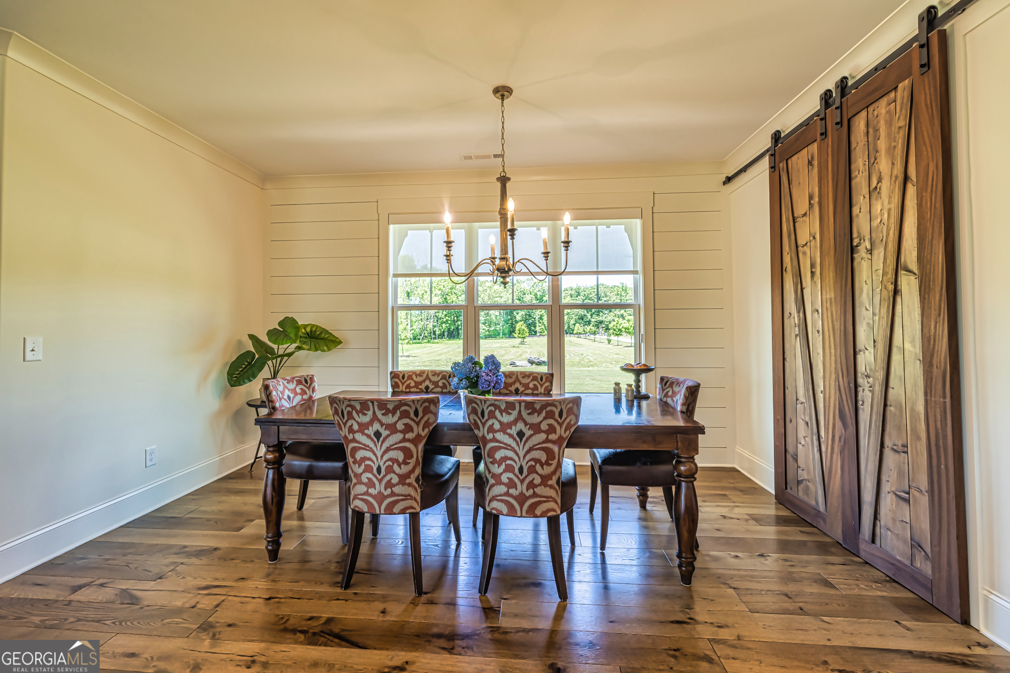 11084 Mt Carmel Road Senoia, GA 30276 - Photo 24 of 136 a view of a dining room with furniture window and wooden floor