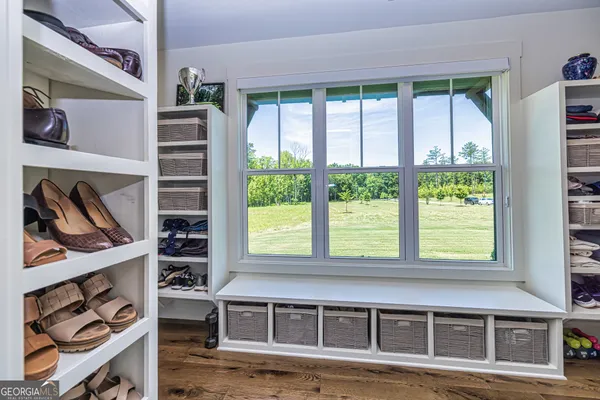 a view of a room with furniture window and wooden floor