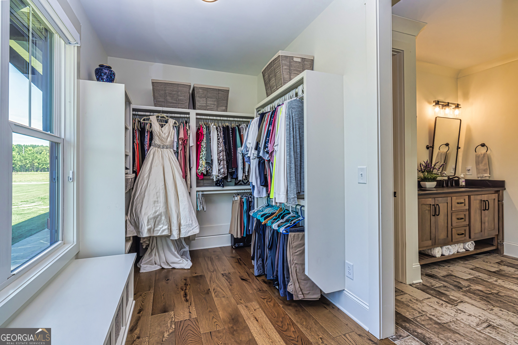 11084 Mt Carmel Road Senoia, GA 30276 - Photo 35 of 136 a view of walk in closet with clothes and shoes
