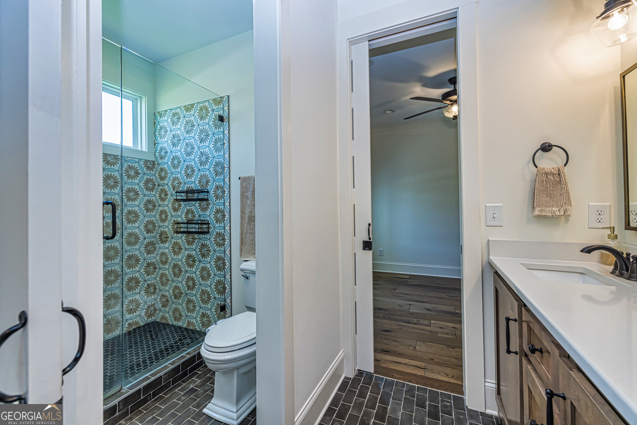 11084 Mt Carmel Road Senoia, GA 30276 - Photo 38 of 136 a bathroom with a sink toilet and shower
