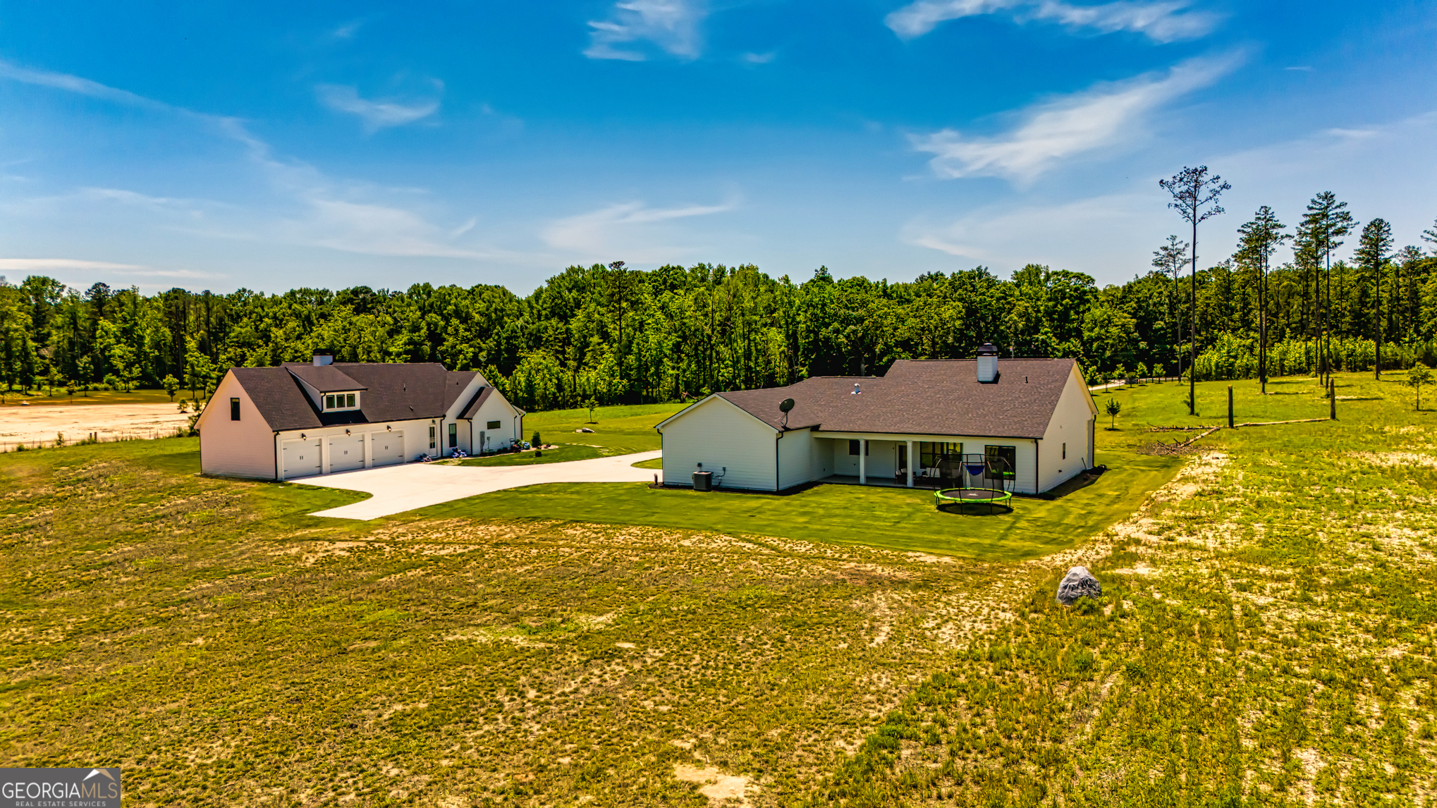 11084 Mt Carmel Road Senoia, GA 30276 - Photo 56 of 136 an aerial view of a house with a yard basket ball court and outdoor seating