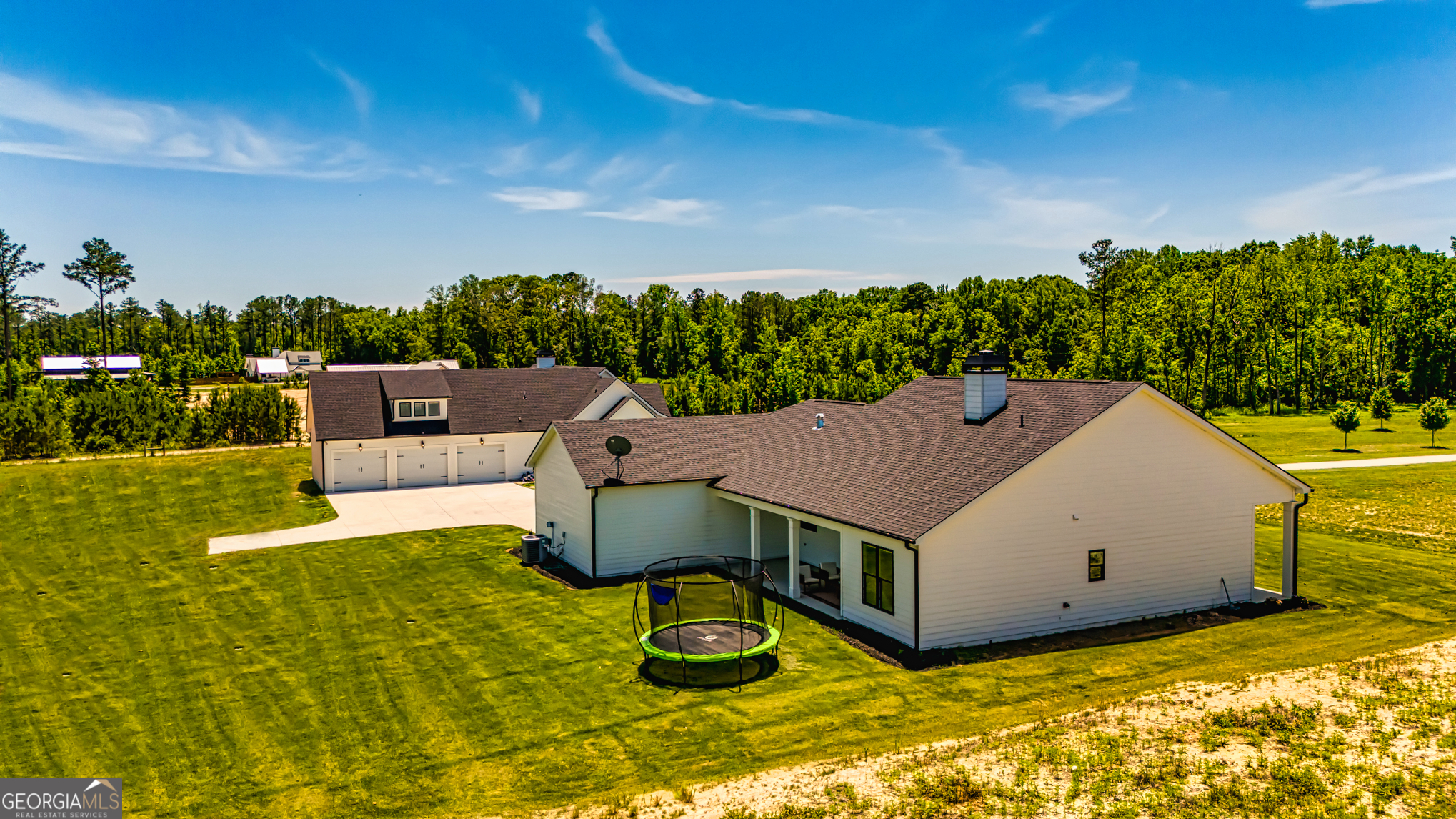 11084 Mt Carmel Road Senoia, GA 30276 - Photo 57 of 136 a aerial view of a house with swimming pool garden view and a big yard