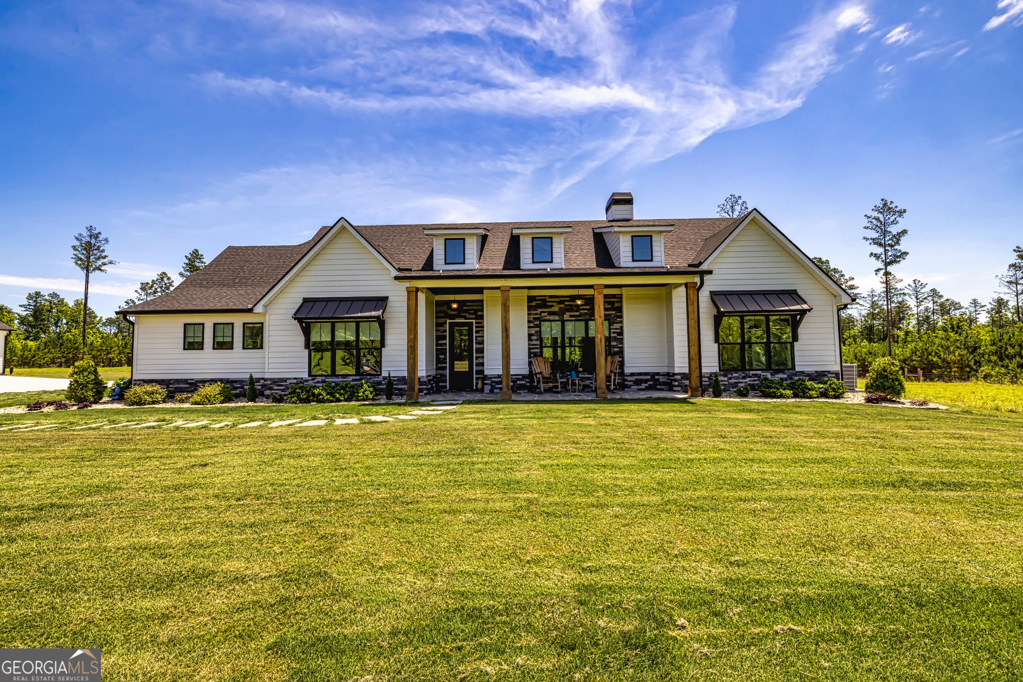11084 Mt Carmel Road Senoia, GA 30276 - Photo 62 of 136 a front view of a house with swimming pool