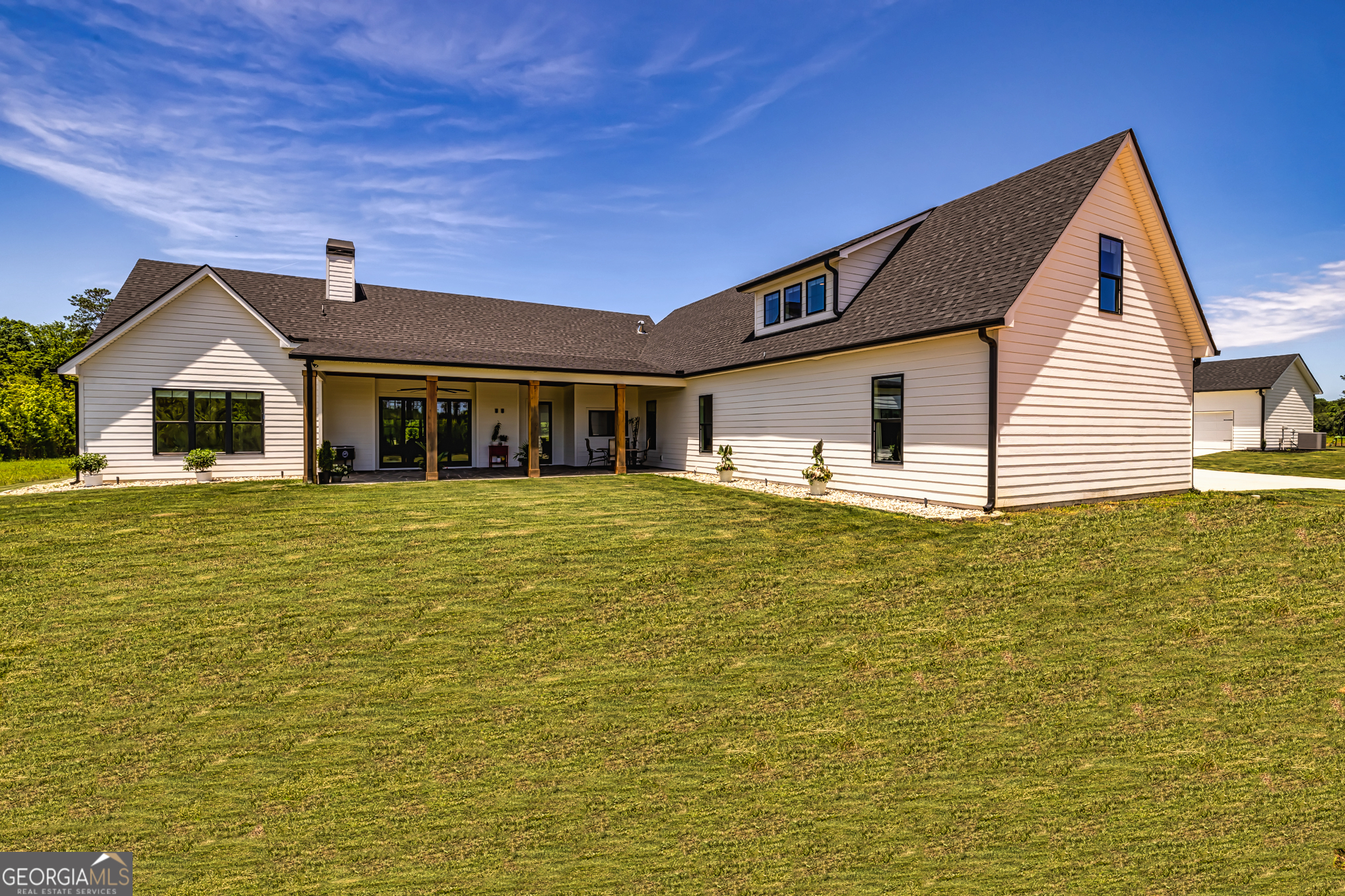 11084 Mt Carmel Road Senoia, GA 30276 - Photo 63 of 136 a front view of a house with a yard
