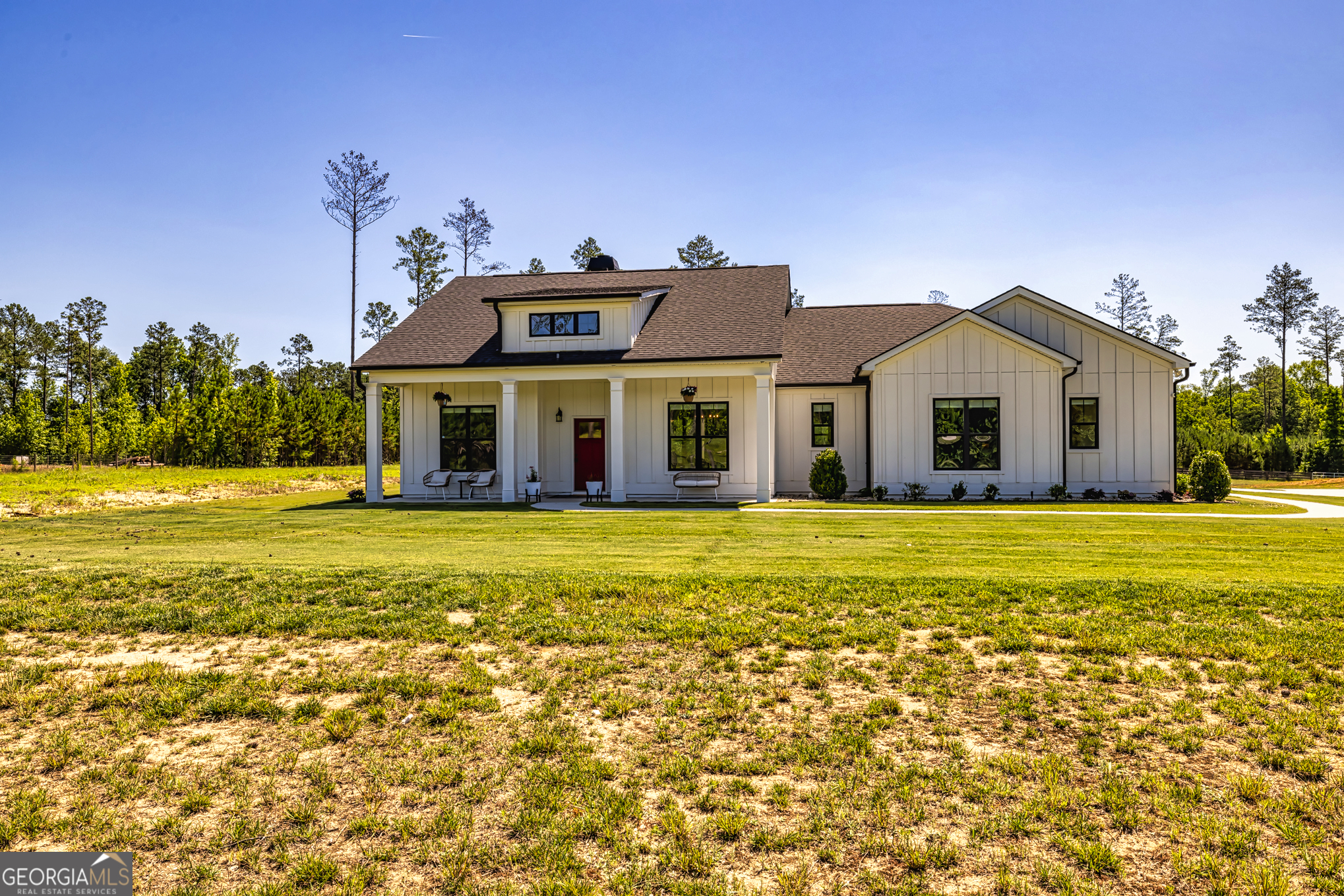 11084 Mt Carmel Road Senoia, GA 30276 - Photo 66 of 136 a front view of a house with a garden