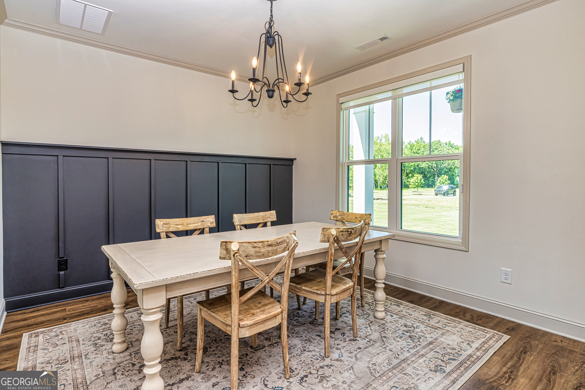 11084 Mt Carmel Road Senoia, GA 30276 - Photo 72 of 136 a view of a dining room with furniture window and wooden floor