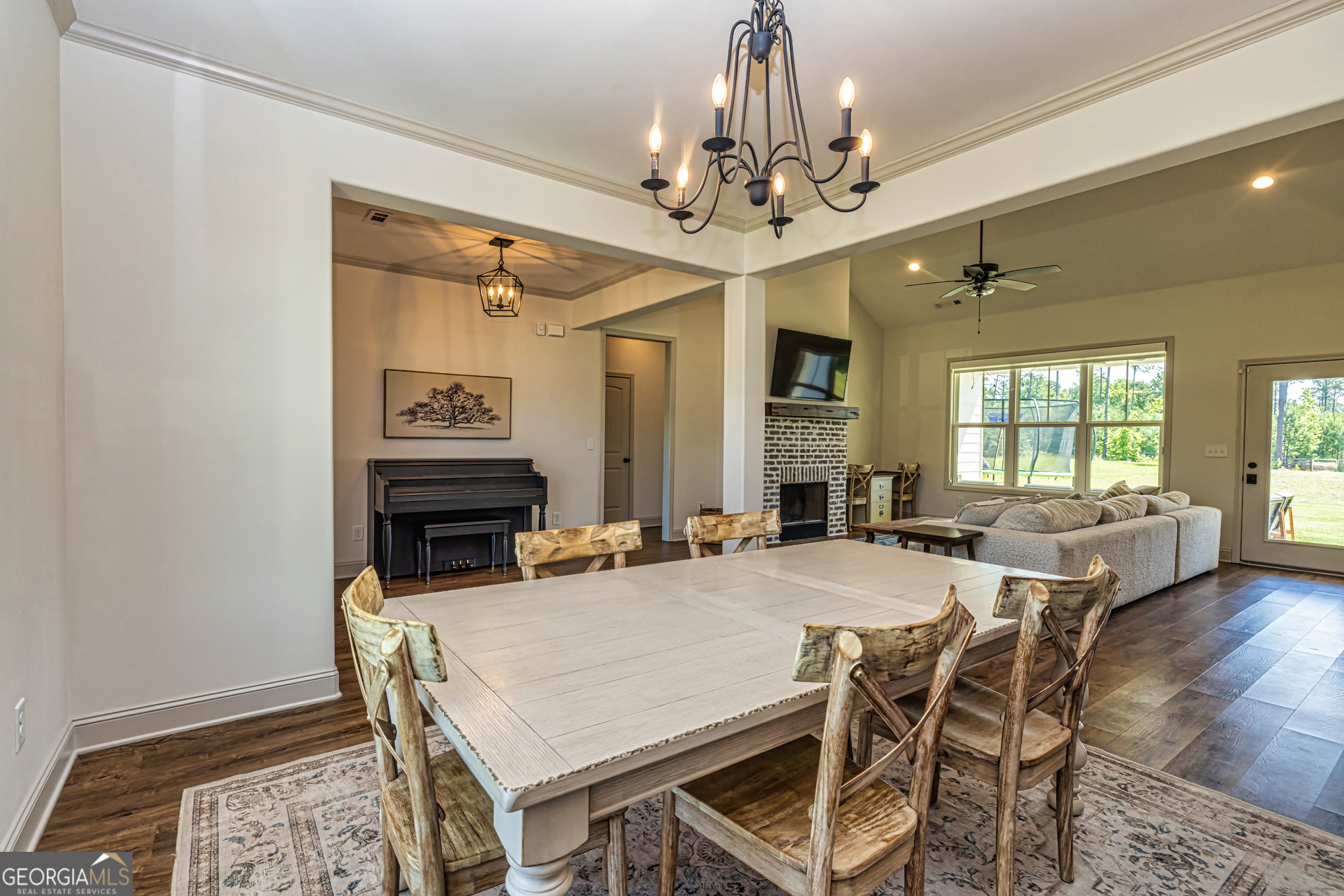 11084 Mt Carmel Road Senoia, GA 30276 - Photo 73 of 136 a view of a dining room with furniture and a chandelier