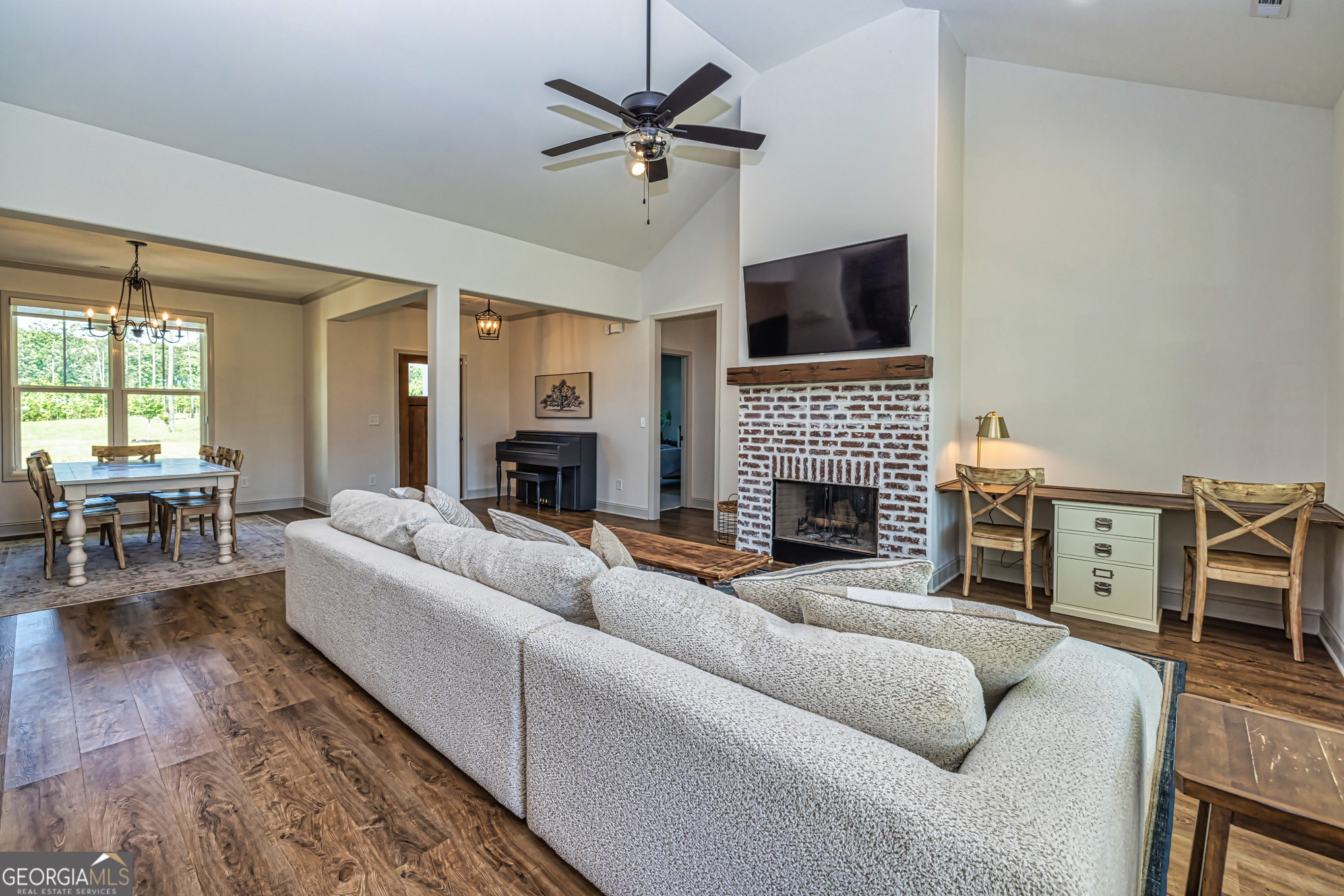 11084 Mt Carmel Road Senoia, GA 30276 - Photo 76 of 136 a living room with furniture fireplace and a flat screen tv