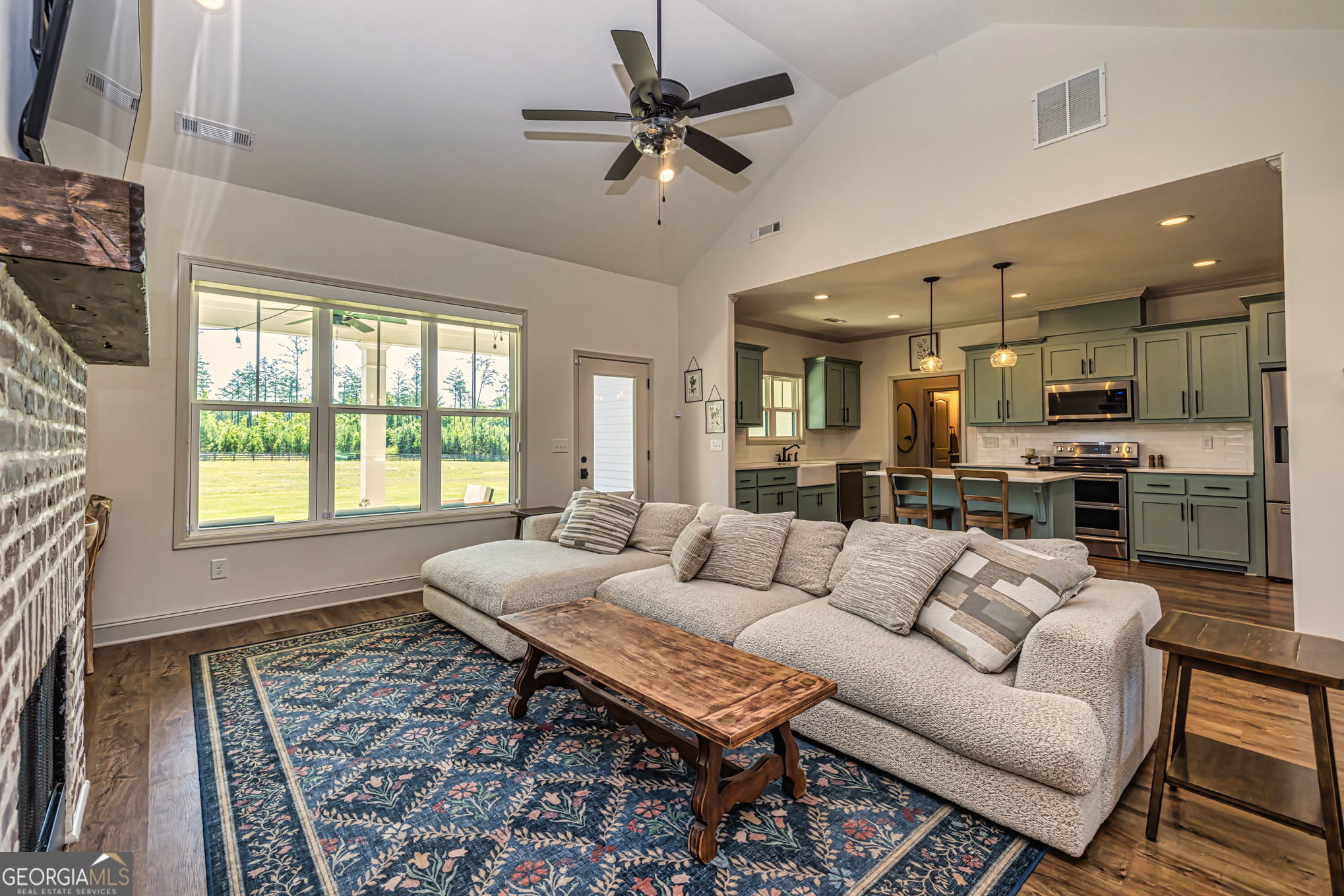 11084 Mt Carmel Road Senoia, GA 30276 - Photo 77 of 136 a living room with furniture and a large window