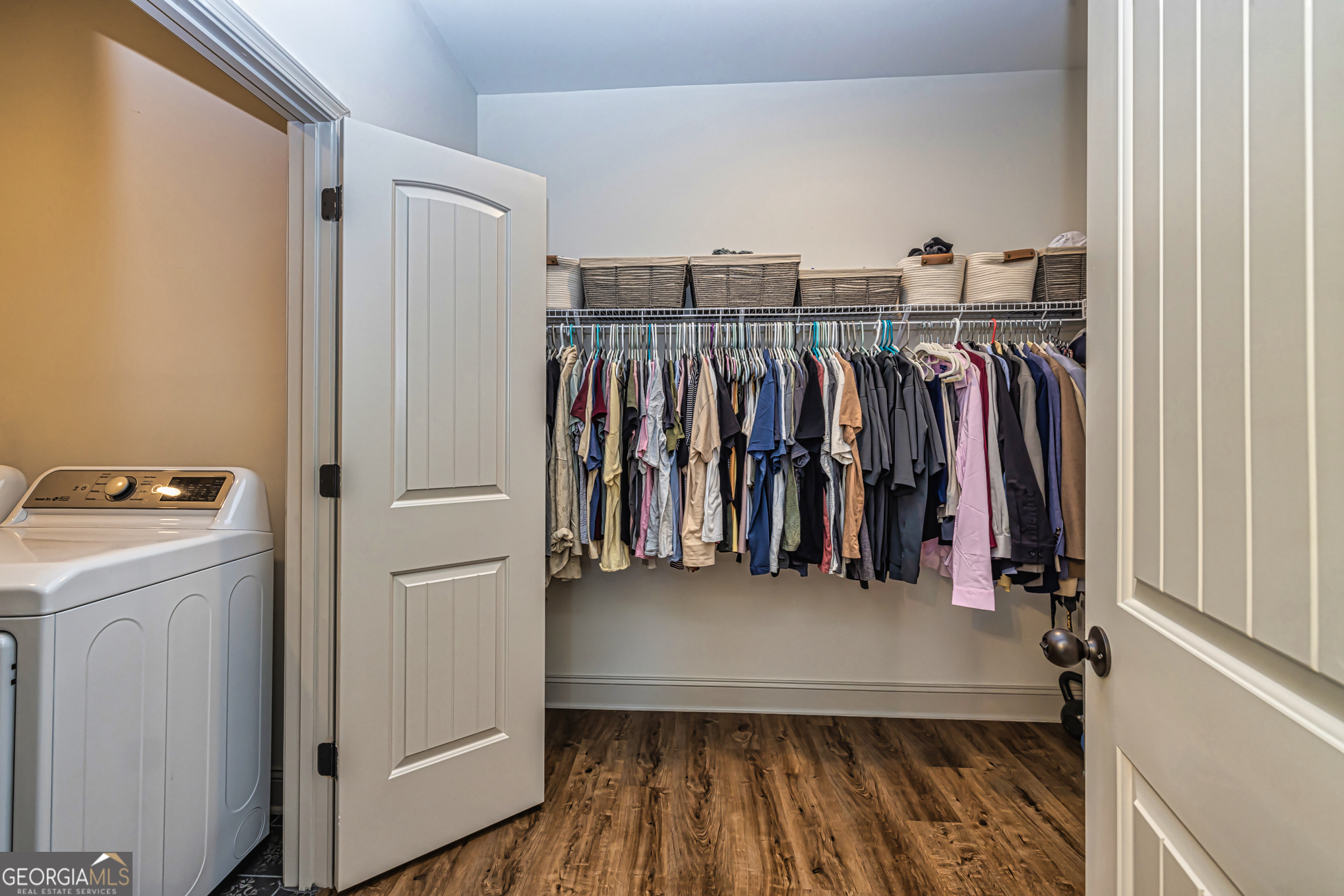 11084 Mt Carmel Road Senoia, GA 30276 - Photo 92 of 136 a view of walk in closet with clothes and shoes