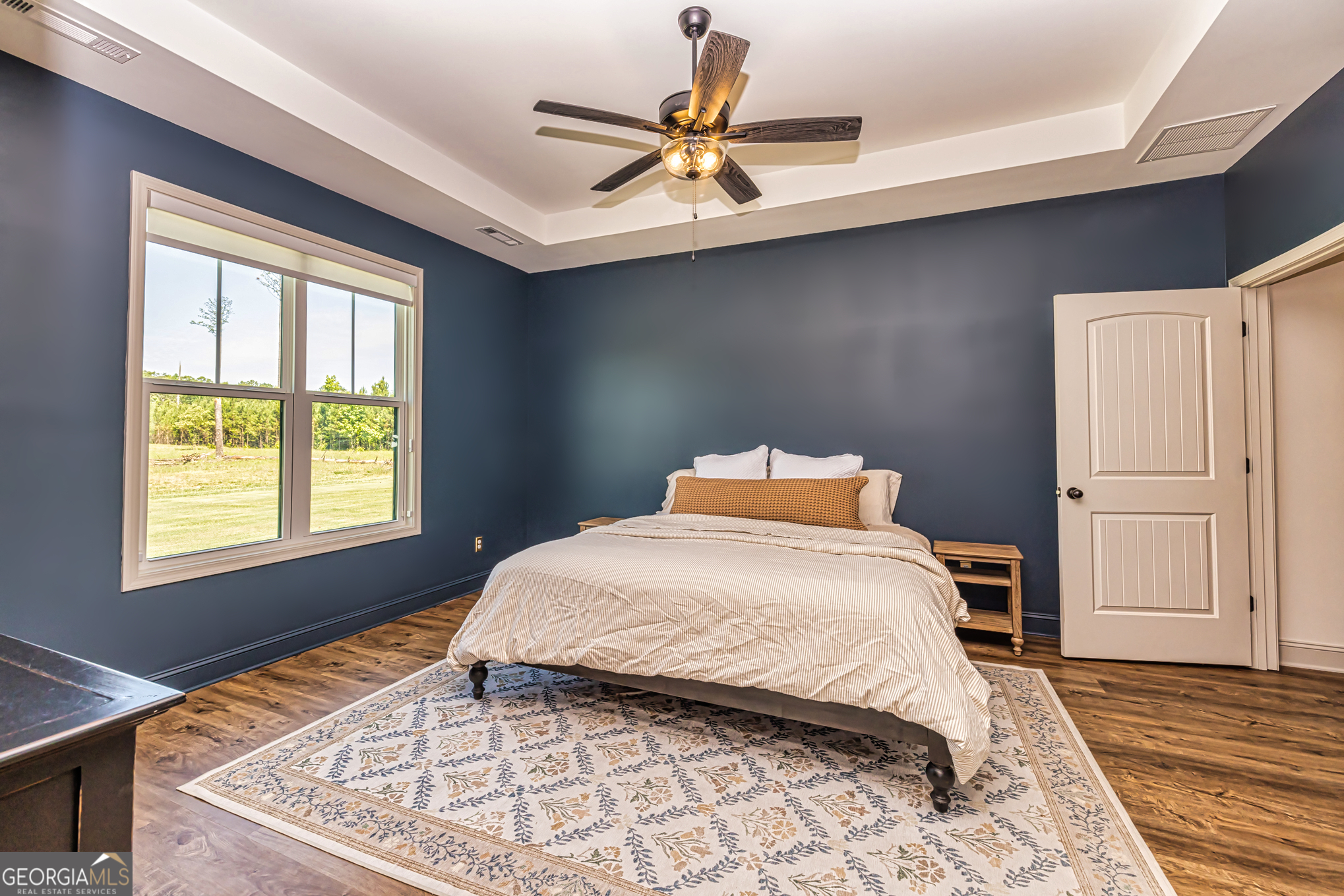11084 Mt Carmel Road Senoia, GA 30276 - Photo 97 of 136 a bedroom with a bed and window