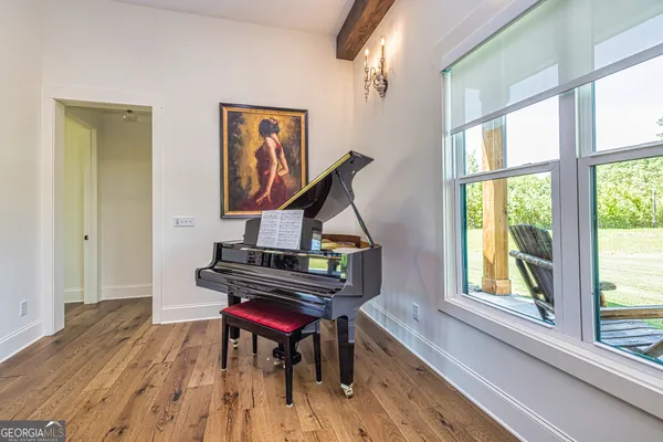 a view of a dining room with furniture window and wooden floor