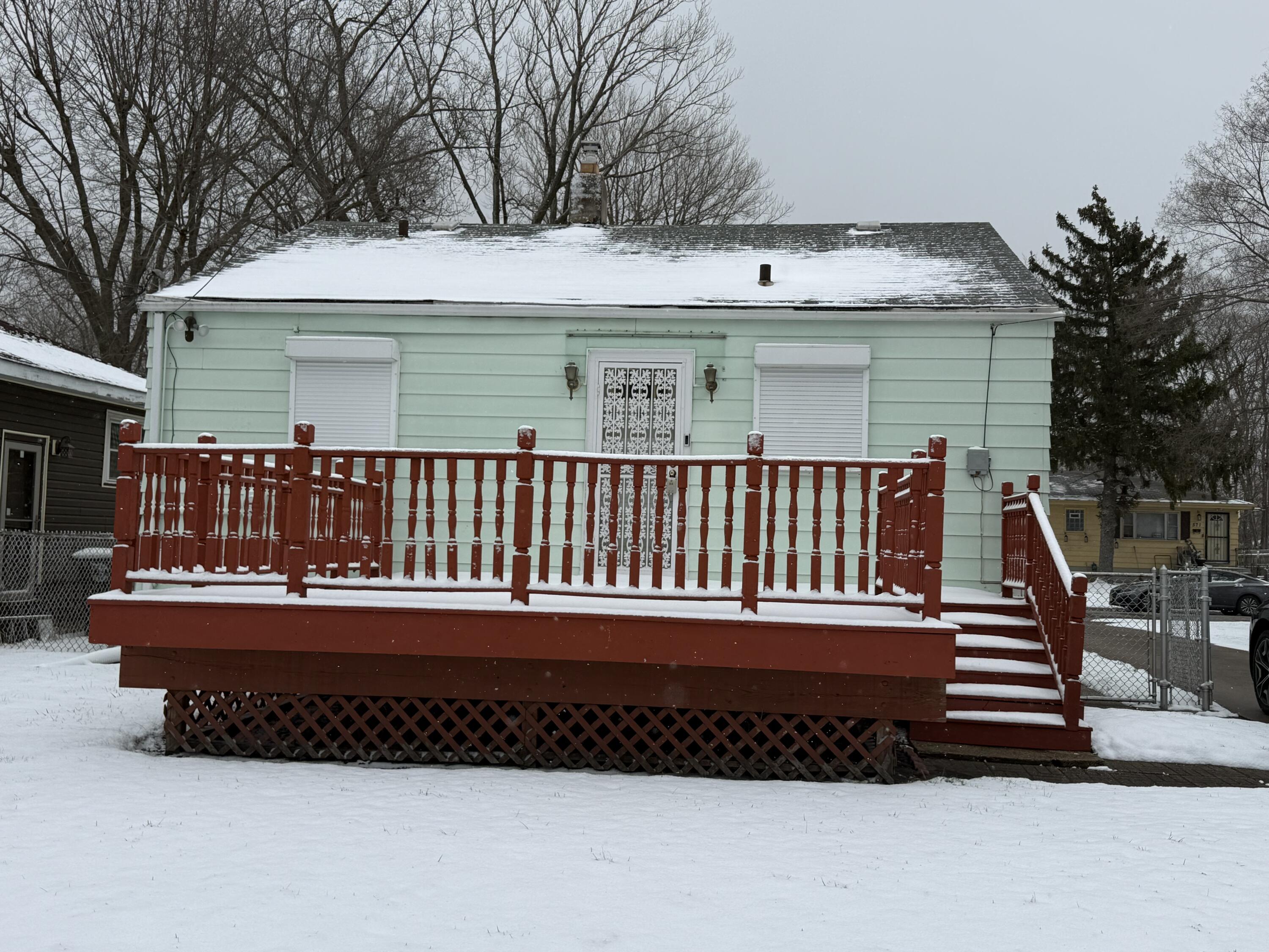 562 Dallas Street Gary, IN 46406 - Photo 14 of 15 a view of a house with a wooden deck