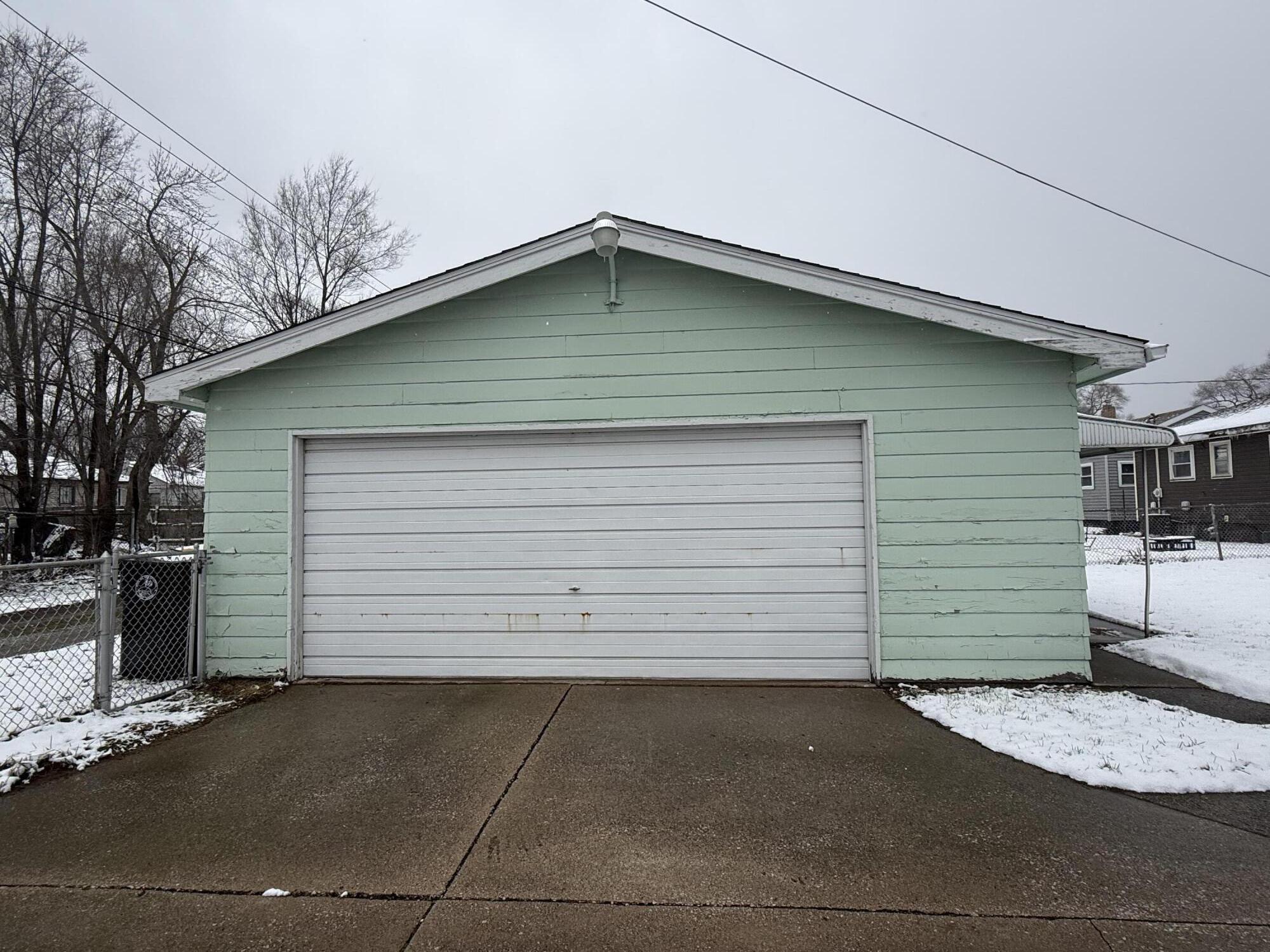 562 Dallas Street Gary, IN 46406 - Photo 15 of 15 a small barn with a table and chair