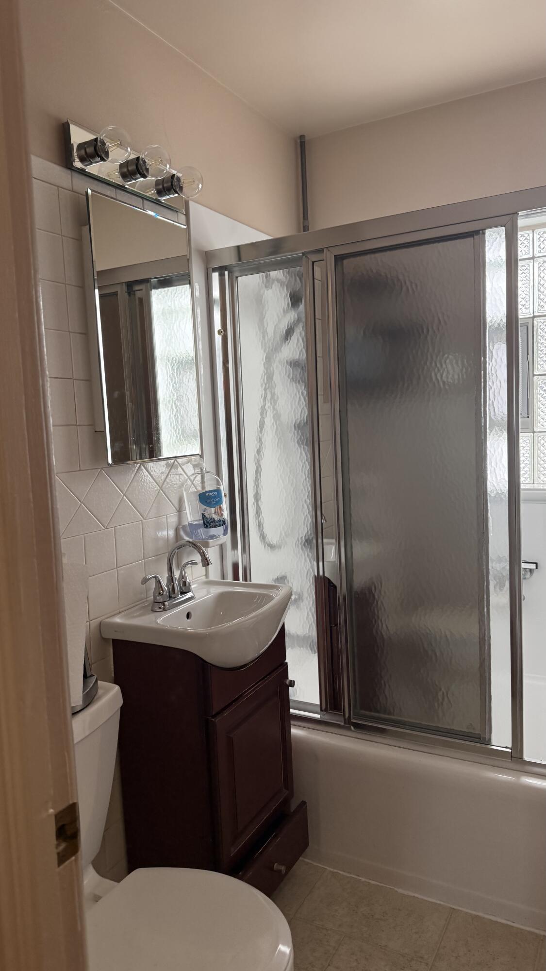 562 Dallas Street Gary, IN 46406 - Photo 5 of 15 a bathroom with a sink toilet and shower