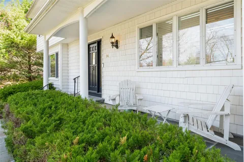 a view of house with backyard and garden