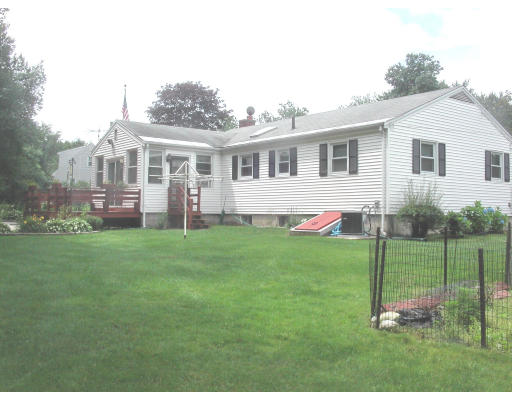 29 Garland Road Chelmsford, MA 01824 - Photo 4 of 15 a backyard of a house with table and chairs
