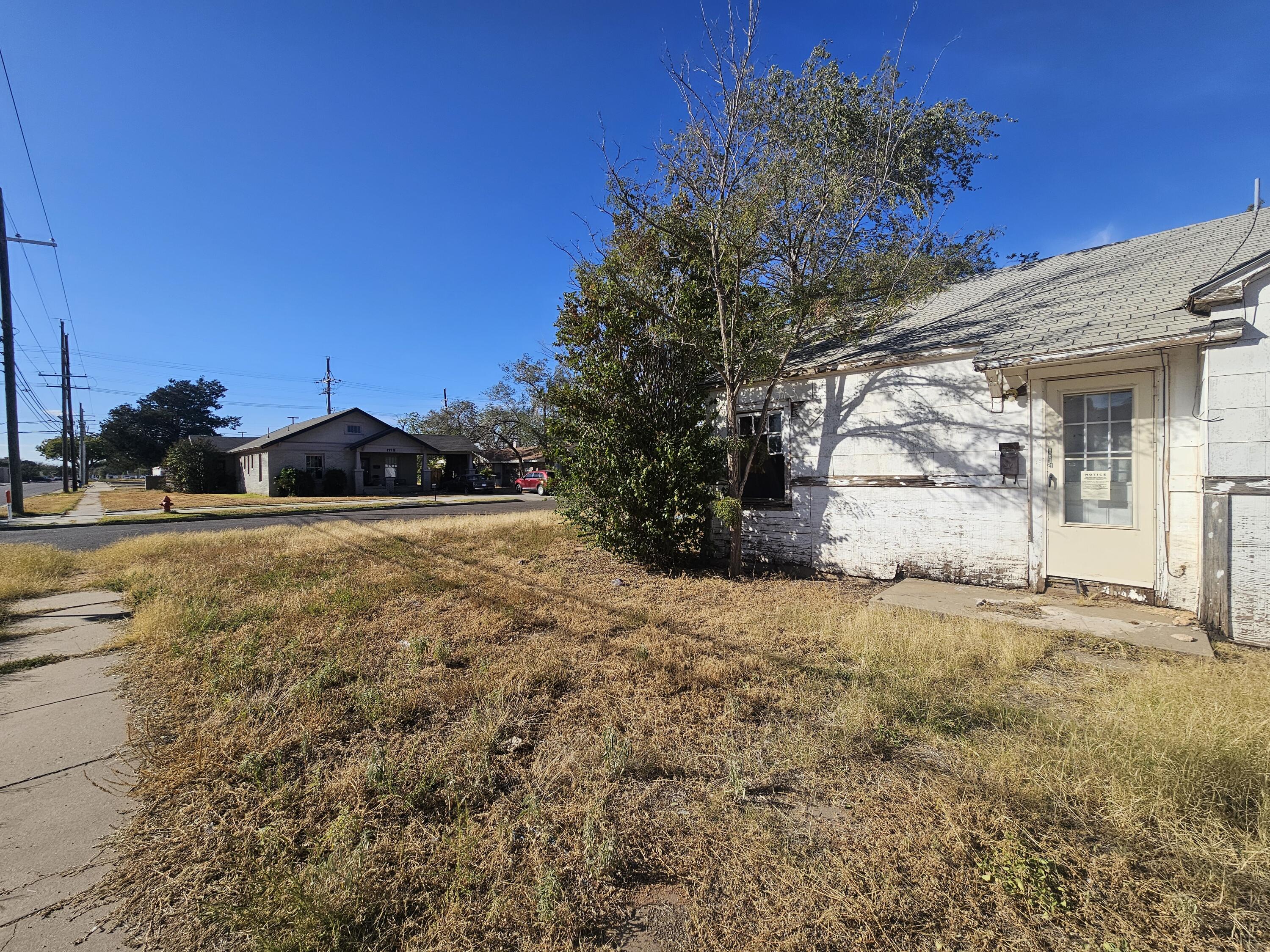 1514 18th Street Lubbock, TX 79401 - Photo 2 of 47 a view of a house with a yard