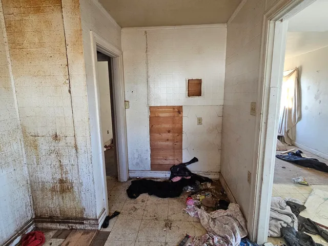 a view of an empty room and window