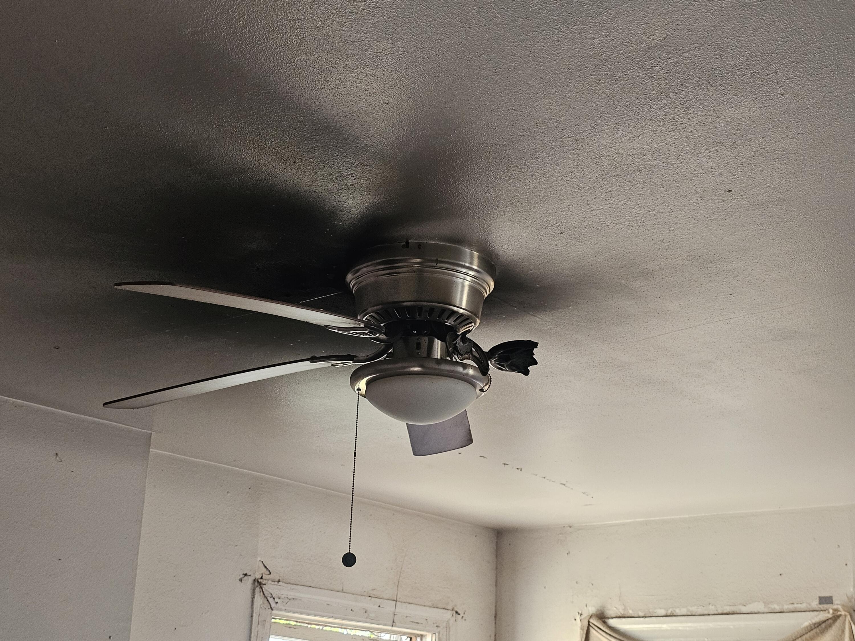 1514 18th Street Lubbock, TX 79401 - Photo 36 of 47 a bathroom with a light fixture and a fan