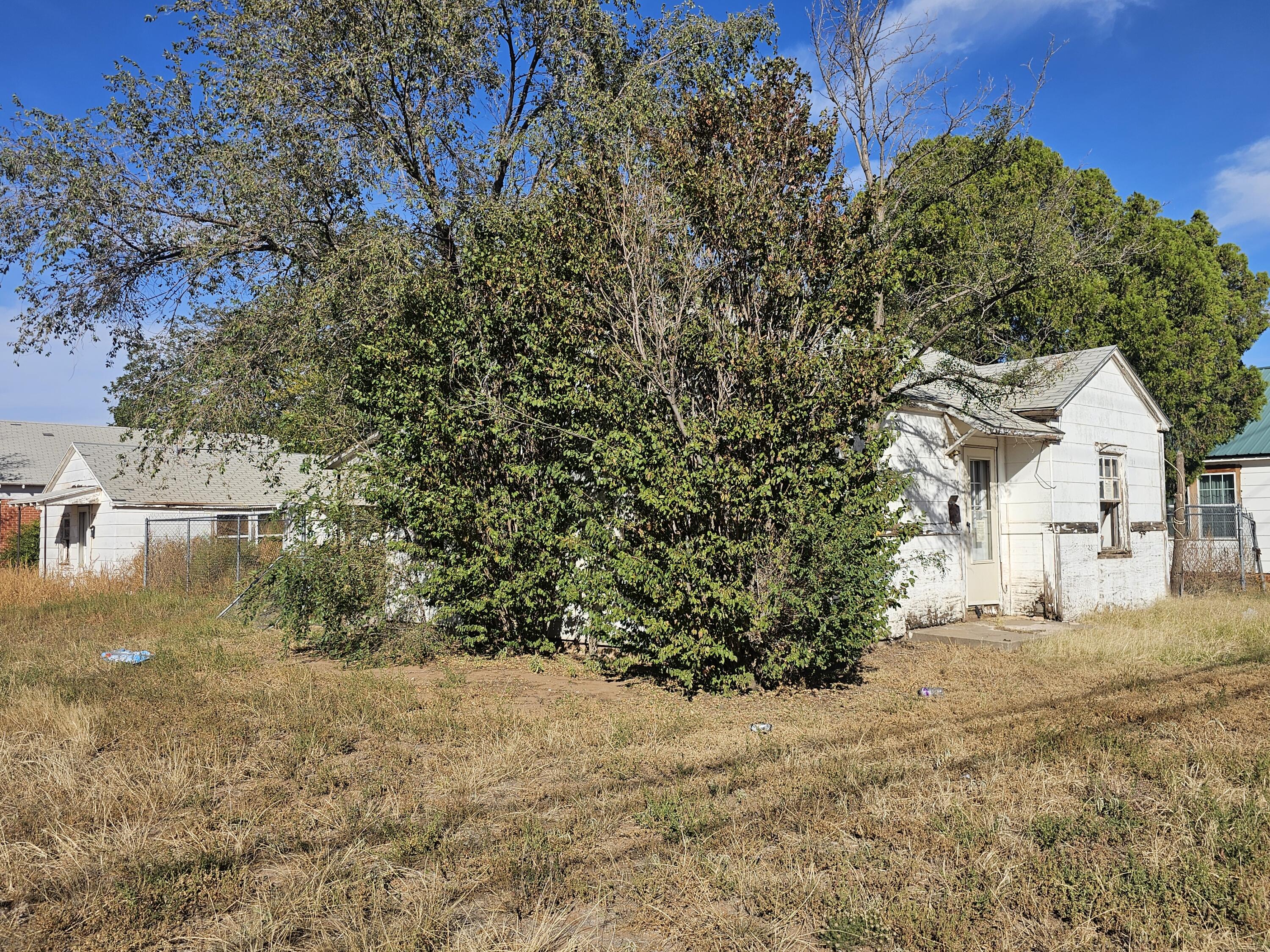1514 18th Street Lubbock, TX 79401 - Photo 4 of 47 a view of a house with a yard
