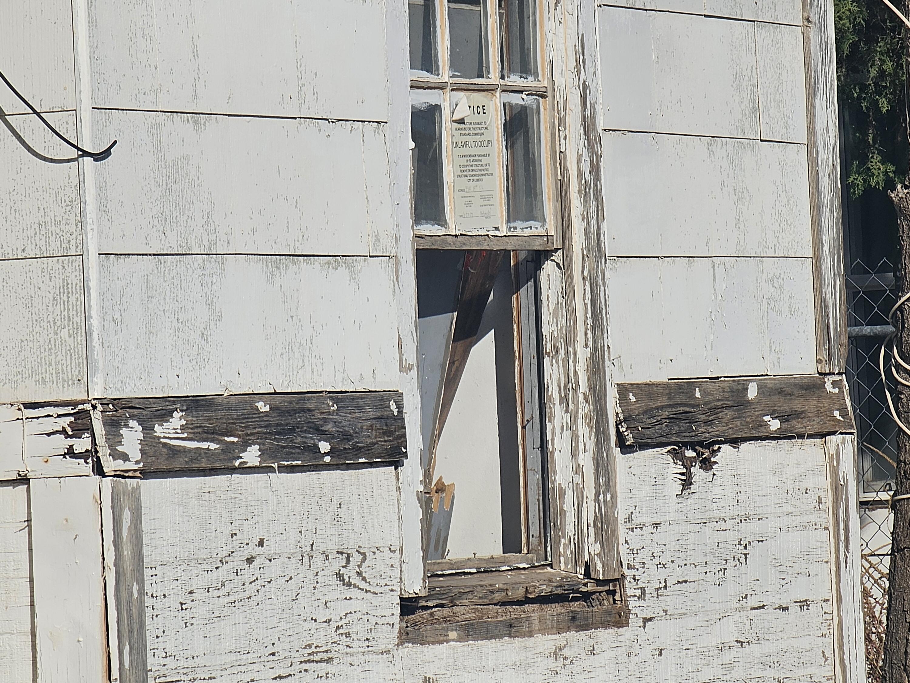 1514 18th Street Lubbock, TX 79401 - Photo 5 of 47 a view of a utility room with wooden floor