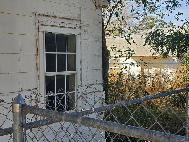 a living room with a fireplace and a flat screen tv
