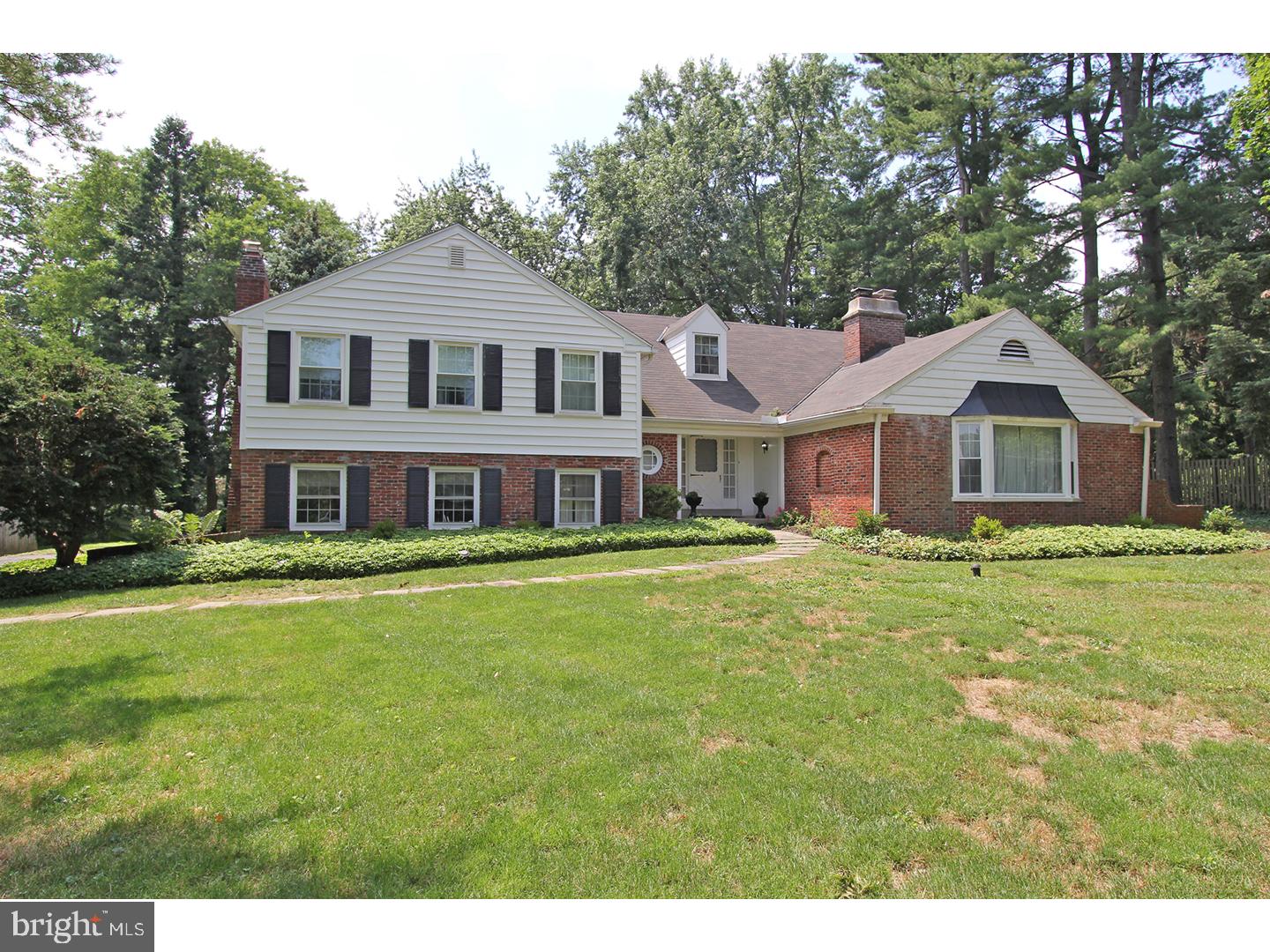 1664 Weedon Road Wayne, PA 19087 - Photo 1 of 24 a front view of a house with a garden