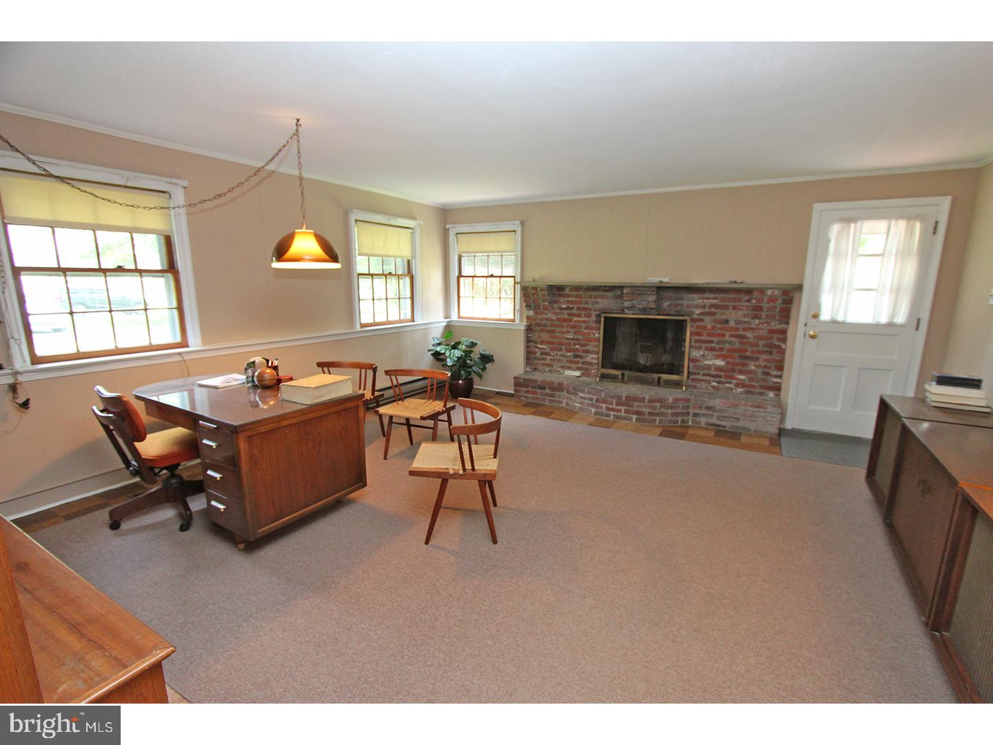 1664 Weedon Road Wayne, PA 19087 - Photo 17 of 24 a living room with furniture a fireplace and a flat screen tv