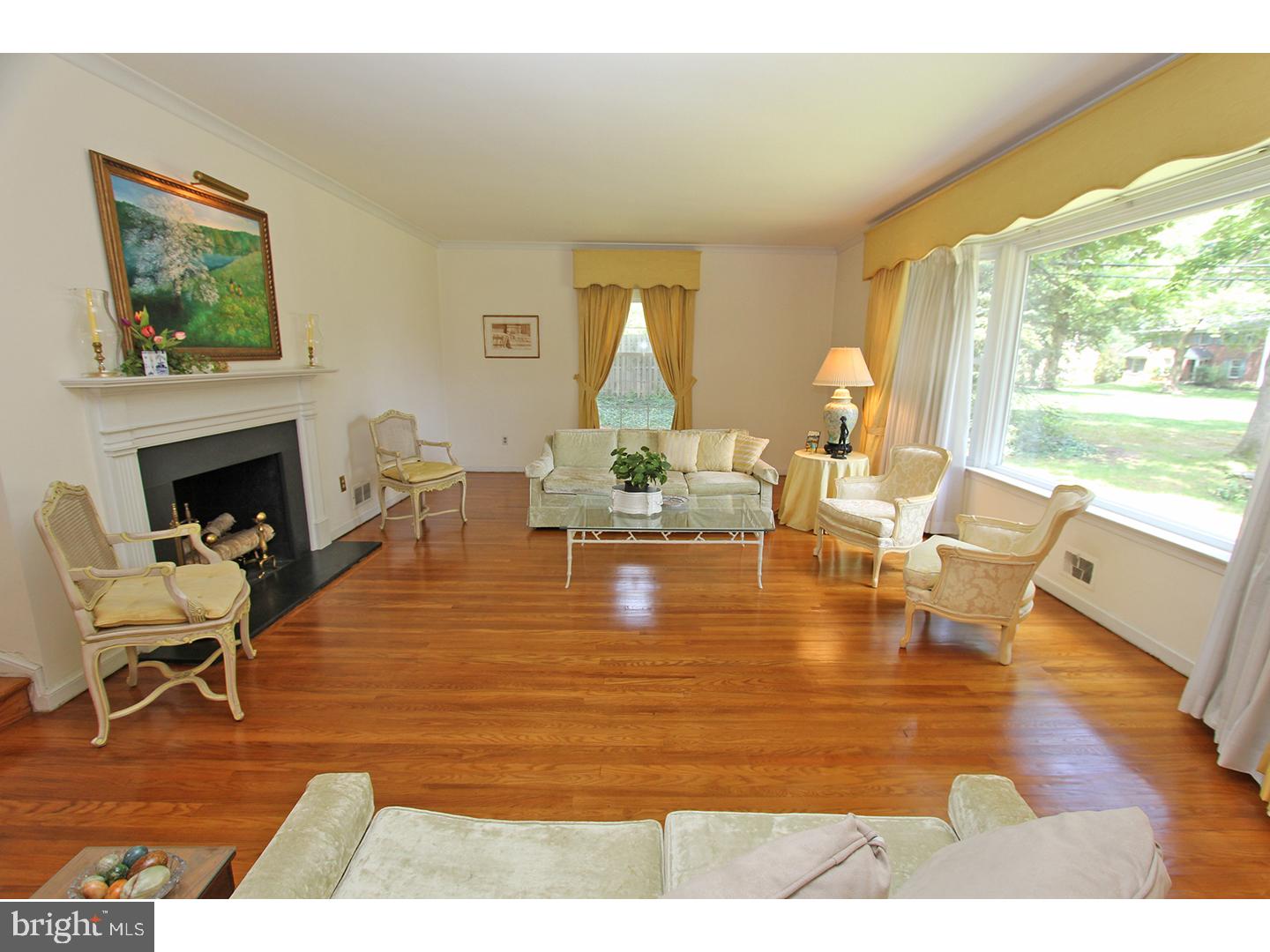 1664 Weedon Road Wayne, PA 19087 - Photo 4 of 24 a living room with fireplace furniture and a large window
