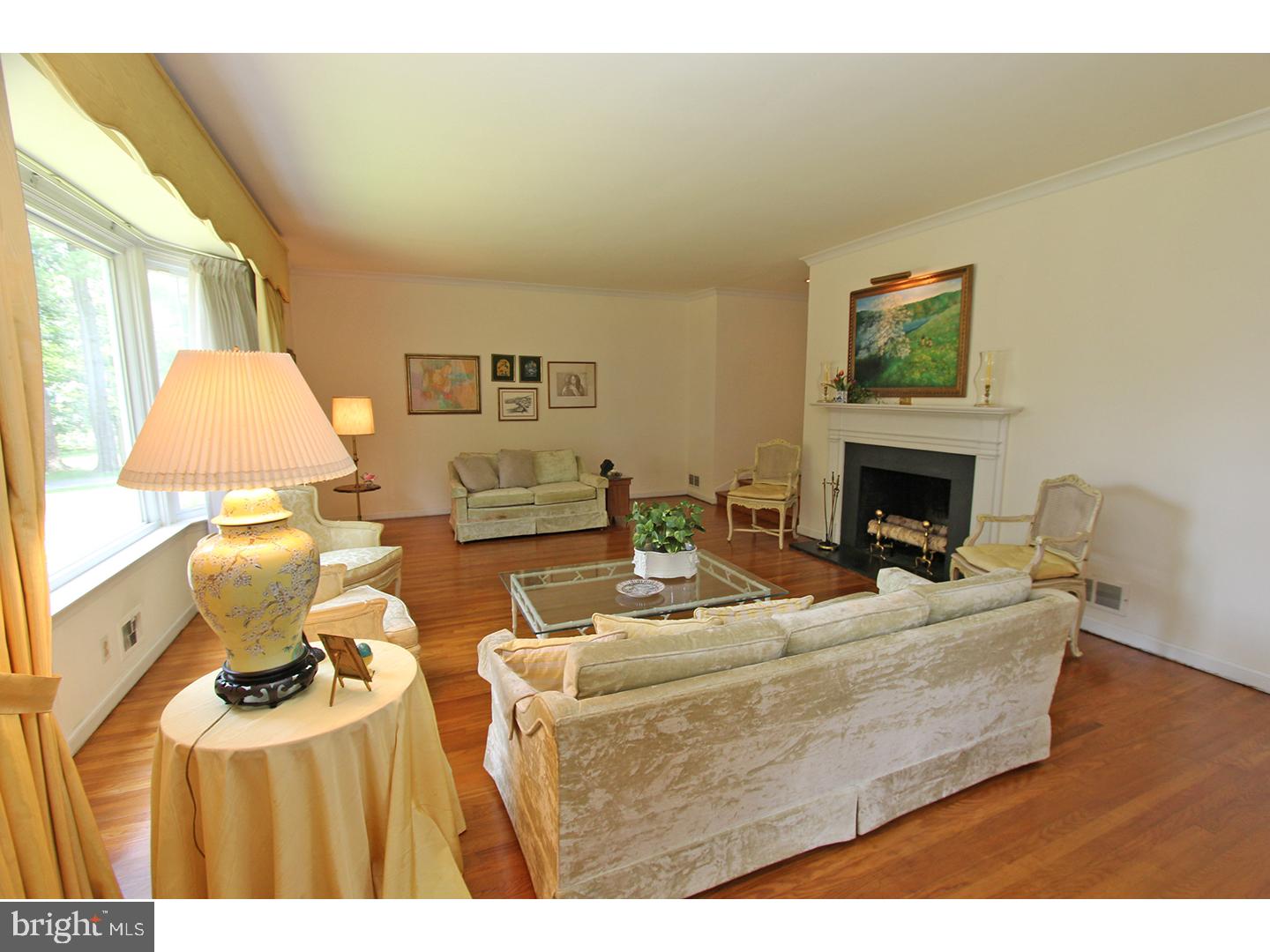 1664 Weedon Road Wayne, PA 19087 - Photo 5 of 24 a living room with furniture a fireplace and a large window