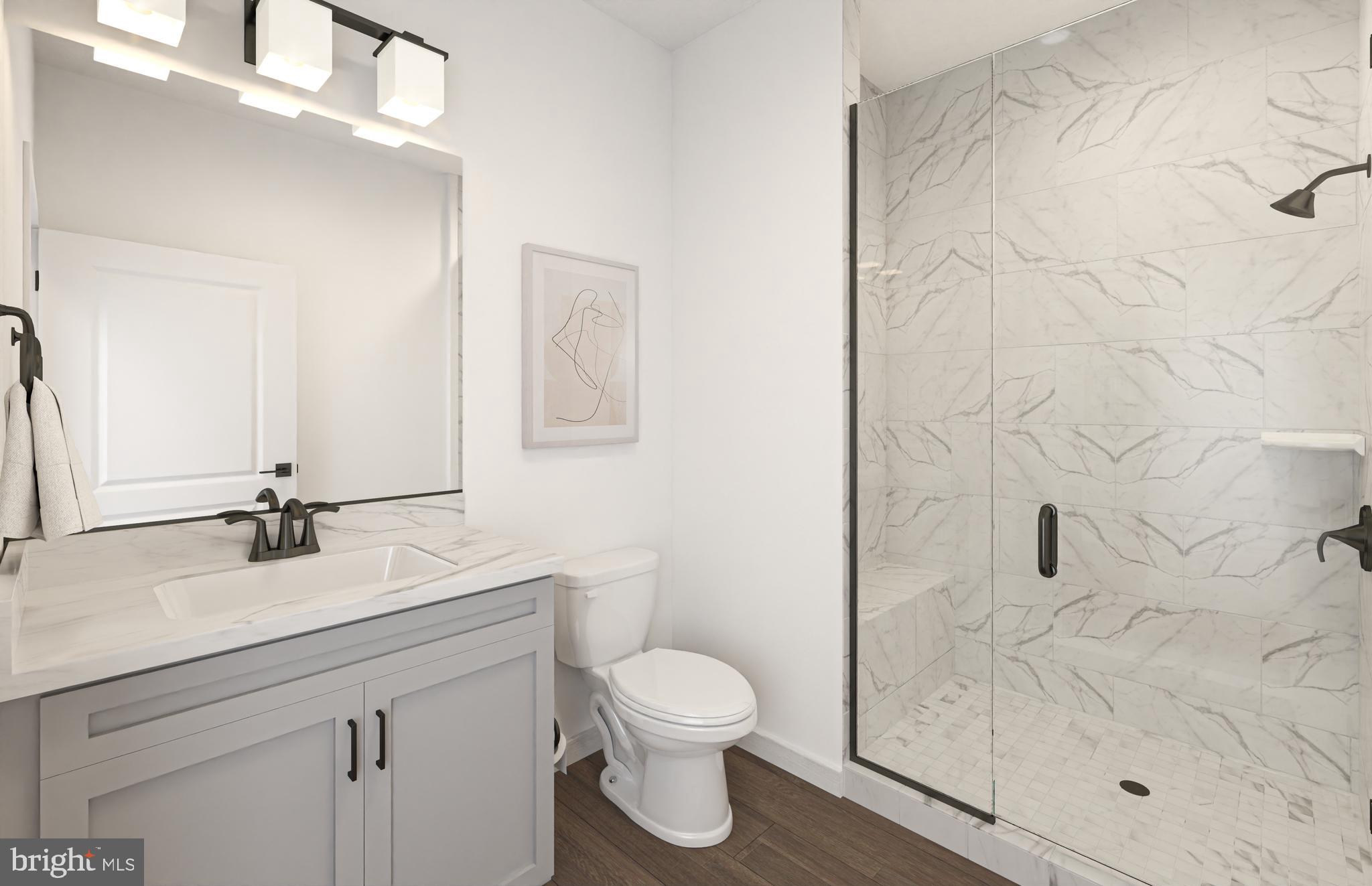 1121 Fortune Terrace, Unit 1 Potomac, MD 20854 - Photo 9 of 12 a bathroom with a granite countertop sink toilet a mirror and shower